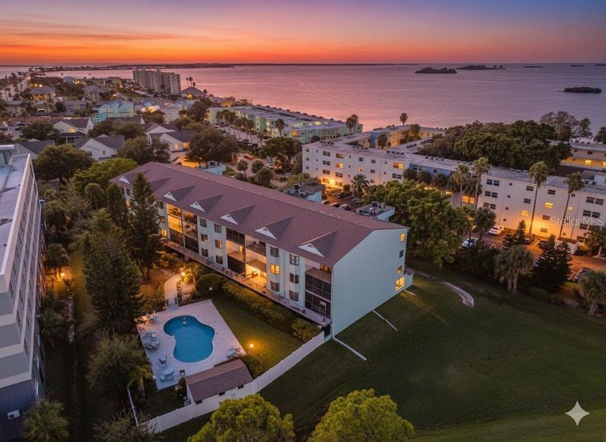 One or more photo(s) has been virtually staged. Welcome to 2651 Michael Place, Unit 107 – Where Coastal Living Meets Modern Luxury
Just minutes from the pristine shores of Honeymoon Island State Park—praised by Tripadvisor as a “Florida nature dream” with miles of beaches, turquoise waters, shaded trails, and abundant wildlife—this beautifully renovated residence offers the perfect blend of tranquility and convenience.
This spacious 2-bedroom, 2-bath home is designed for both comfort and style. Its open-concept layout flows seamlessly, creating an inviting space for everyday living and effortless entertaining. A rare feature in condo living, this home boasts two private balconies, with the north-facing one offering partial water views of St. Joseph’s Sound, ensuring a true indoor-outdoor lifestyle.
Following a meticulous $100,000 renovation, every detail reflects modern elegance. Rich hardwood-like vinyl planking sets a warm foundation throughout, while the chef’s kitchen impresses with high-end stainless steel appliances, custom cabinetry, and quartzite countertops. The adjoining dining and living areas open gracefully to the balconies, flooding the home with natural light.
The primary suite serves as a private retreat with a spa-inspired bathroom and walk-in closet, while the secondary bedroom and bath echo the same sense of refinement. Additional updates—including a newer high-efficiency HVAC system, BRAND NEW HOT WATER HEATER AS OF OCT 2025, newer washing machine and dryer, furnace, and ceiling fans—ensure peace of mind as well as beauty.
Beyond the residence, the community elevates the experience with a sparkling pool, updated poolside facilities, a dedicated storage unit, and the convenience of a covered dedicated parking space.
This property represents exceptional value, offering a standard of living rarely found at this price point. Experience coastal Florida living at its finest—welcome home to 2651 Michael Place, Unit 107.