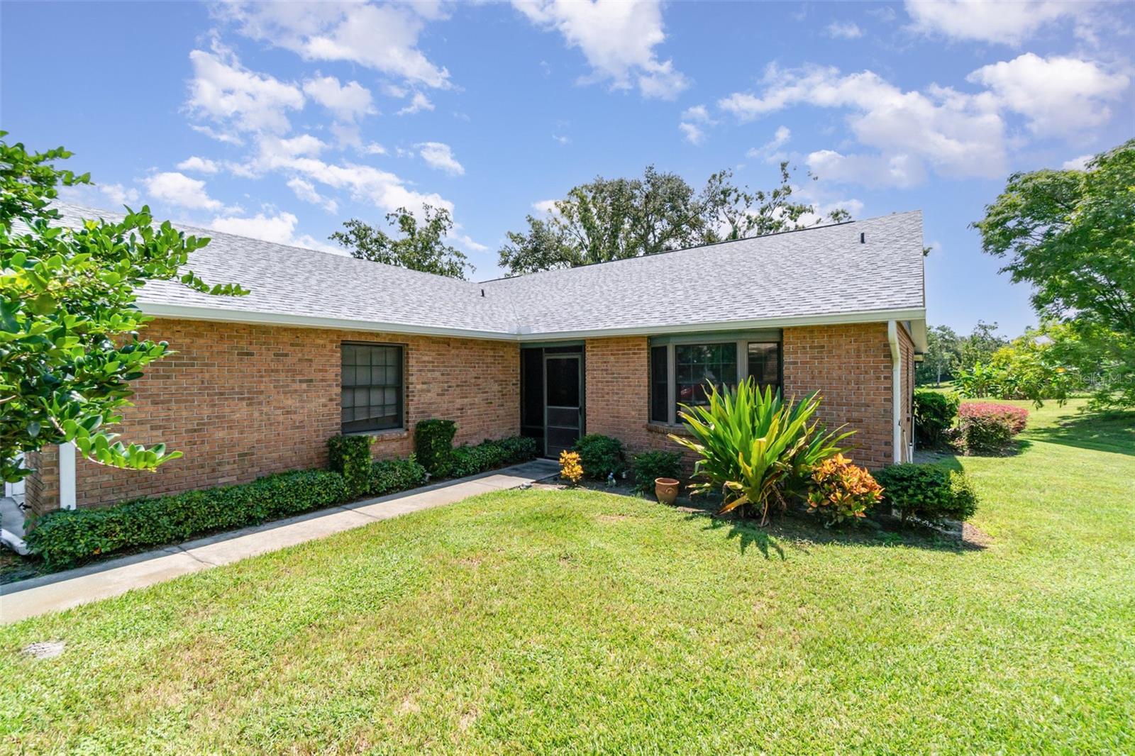 Tucked away on a quiet street, this charming townhome offers comfort, space, and thoughtful touches. Step onto the inviting front porch, then inside to an open floor plan with vaulted ceilings that create a light, airy feel. The kitchen features a convenient pass-through bar, perfect for entertaining or casual meals. Enjoy the outdoors year-round on the screened-in back porch, overlooking a large backyard with endless possibilities; gardening, relaxing, or play. Practical updates include a 3-year-old roof and water heater, giving peace of mind for years to come. Whether you're hosting guests or enjoying quiet evenings at home, this well-designed space blends functionality with charm. Easy access to the parks, shopping and restaurants makes it convenient as much as it is comfortable. Ideal for anyone seeking a low-maintenance lifestyle with indoor-outdoor flow, all in a peaceful, friendly neighborhood. This townhome is more than move-in ready, it’s ready to be lived in and loved.