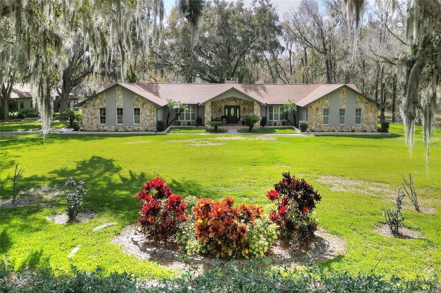This 24± acre beautiful sprawling estate serves as a unique investment opportunity with over 900 feet of road frontage on County Line Road, which has seen explosive industrial and commercial growth over the past few years. The property has access off of two roads, County Line Road and E. Trapnell Road with a median break on County Line Road, allowing easy access in and out. There is a 3,752sf block home which sits surrounded by exquisite oaks and has been meticulously cared for, highlighting character and providing plenty of space for family gatherings. The home sits over 700' off of County Line Road, with a natural buffer, providing a peaceful setting with 4 bedrooms and 3 bathrooms. Boasting a 23'x14.5' kitchen, leading into the living room with cathedral ceilings and a charming working fireplace, with a sun room getaway outfitted with an indoor cooker vented up the chimney and a wet bar. There is a 100' x 40' building which has an efficiency apartment ready for a guesthouse renovation, along with roll up doors on multiple sides for equipment storage or a shop. This could be an excellent investment to live in while holding until the future growth inevitably comes through this property.