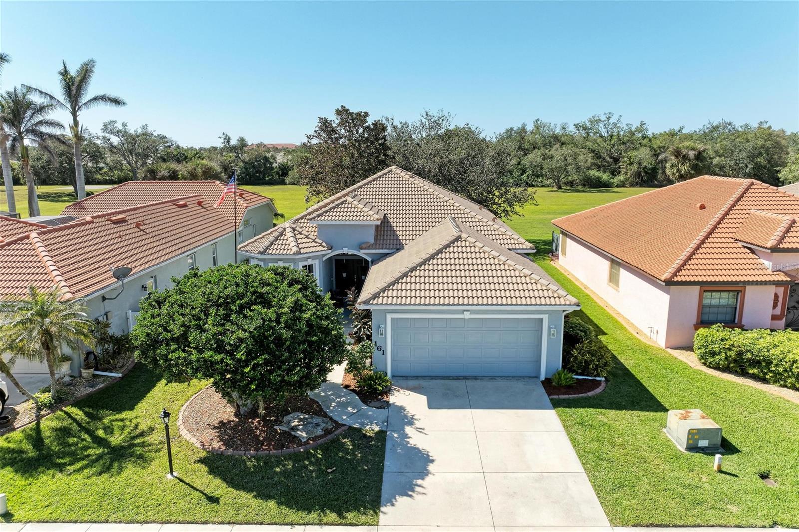 Sellers are motivated- just reduced! This home is the only one currently for sale in this highly sought-after community of VALENCIA LAKES. Featuring 3 bedrooms, 2 bathrooms and 1740 square feet of living space, a split floor plan, and an open ambiance thanks to volume ceilings. Low HOA and no CDD fees. Recent upgrades: 2023 HVAC system, 2022 exterior repaint, and newer dishwasher and fridge. An open floor plan perfect for daily living and entertaining. One of the best features of this home is the Florida room with glassed-in windows and screens for dining and relaxation overlooking a serene garden. The master bedroom easily accommodates a king-sized bed, walk-in closet, and a master en-suite bathroom with dual sinks and a walk-in shower. Two additional spacious bedrooms, with one that can serve as a den. Tile flooring and luxury vinyl flooring throughout- NO CARPET. Sunny breakfast room adjoining the kitchen which also boasts a breakfast bar. No need for a private pool as Valencia Lakes offers a saltwater pool for recreation. The home is a 10-minute drive from historic downtown Venice, with easy access to restaurants, shopping, beaches, boating, shelling, and year-round activities.