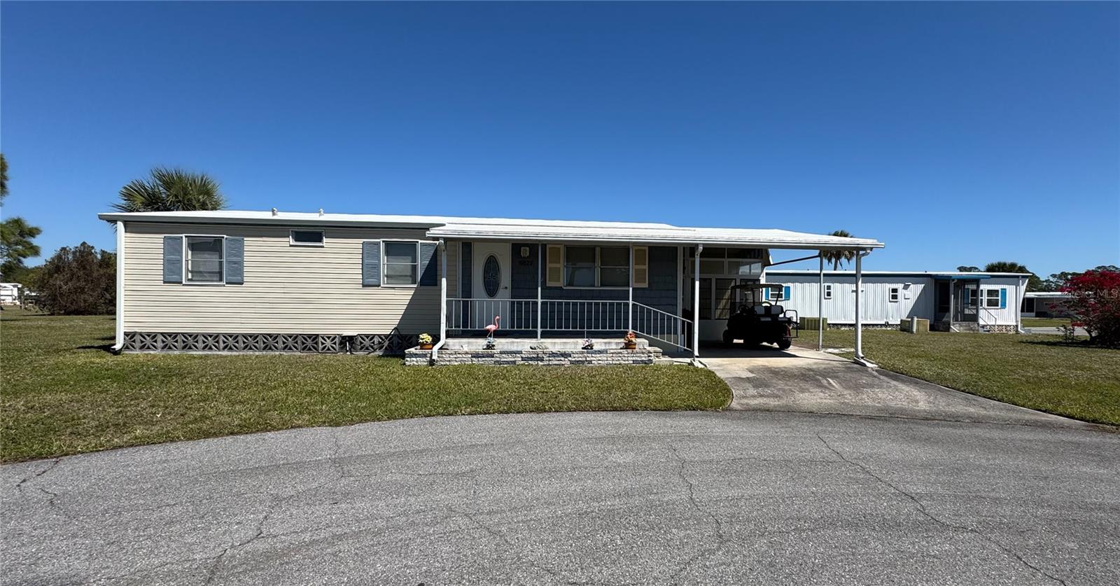 Nestled in the highly sought-after, land-owned 55+ gated community of Holiday Park in North Port, FL, this charming 3-bedroom, 2-bath mobile home offers both comfort and convenience in an active adult setting. Located in the pet section on a peaceful cul-de-sac, the home sits on a spacious pie-shaped lot, providing extra privacy and room to enjoy the Florida lifestyle. The 2023 membrane roof ensures durability, while the beautifully updated kitchen features new cabinets, a stylish backsplash, and sleek countertops, making meal preparation a delight.
Step outside and relax on your welcoming front porch or retreat to the vinyl-window enclosed lanai, perfect for year-round enjoyment. Holiday Park is known for its vibrant and engaging community, offering an array of amenities included in the maintenance fee, which is conveniently paid through your tax bill. Residents enjoy access to two refreshing pools, shuffleboard and pickleball courts, a well-equipped fitness center, and a clubhouse bustling with daily activities and social gatherings.
Ideally situated in North Port, this home is close to shopping, dining, medical facilities, and some of Florida’s most beautiful Gulf Coast beaches. Whether you're looking for relaxation or an active lifestyle, Holiday Park provides the perfect blend of both. Don't miss this opportunity to own a piece of paradise in one of North Port’s most desirable 55+ communities.