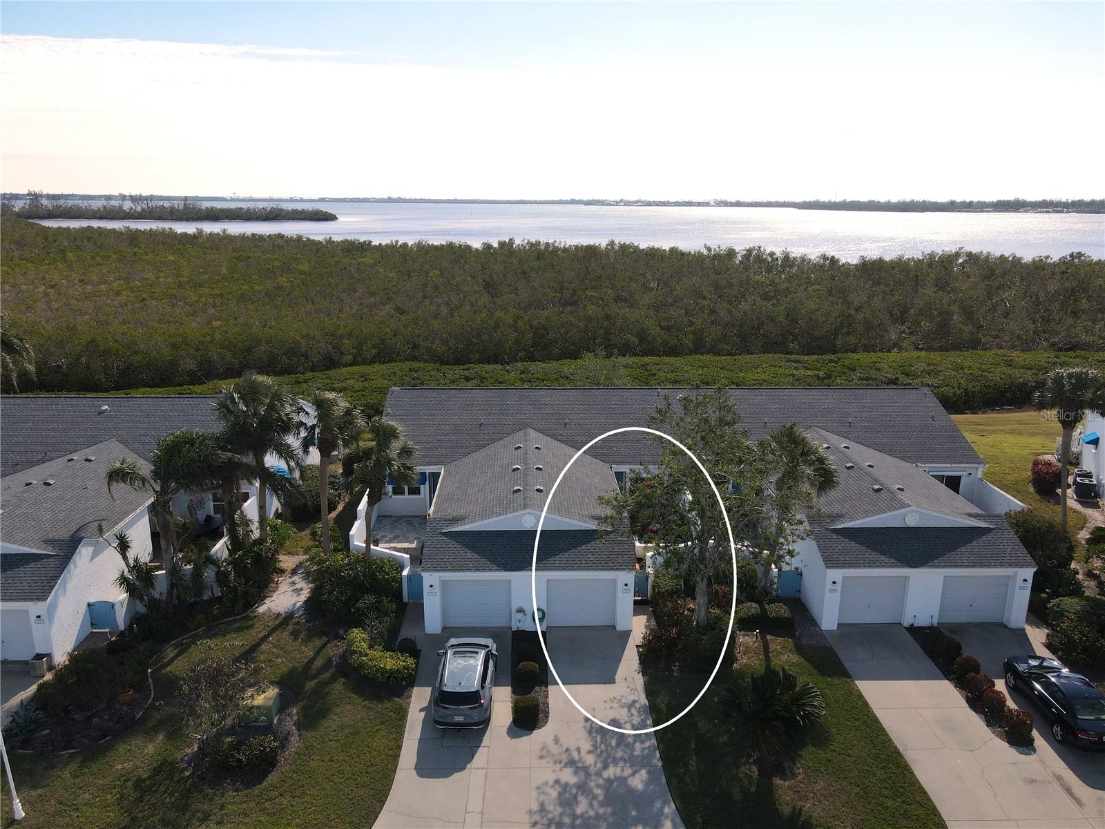 PRICE IMPROVEMENT ON THIS CHARMING VILLA, with NEWLY INSTALLED STAINLESS REFRIGERATOR AND DISHWASHER. NO WATER OR WIND DAMAGE FROM THE RECENT HURRICANES! Close to Anna Maria Island! Come Take a Look at this warm and inviting updated furnished villa, perfectly situated just minutes from Anna Maria Island by car or bike. From the moment you enter the open courtyard, you'll feel the fresh and vibrant ambiance of this Lovely home.
The villa features a lively coastal design with neutral tile flooring throughout the main living areas and kitchen, complemented by wood-look luxury vinyl flooring in both bedrooms. The spacious, open-concept living and dining areas are the heart of the home, enhanced by vaulted ceilings that create an expansive, airy feel. Natural light floods the space through sliding doors in nearly every room.
The bright kitchen boasts light cabinetry with ample storage, solid surface countertops, and a newer suite of Samsung appliances, including a 2025 refrigerator and dishwasher. It’s a delightful space for cooking and entertaining.
The primary bedroom offers serene views of mangroves and local wildlife, along with a large walk-in closet and an updated en-suite bathroom featuring a shower, a newer vanity, marble countertop, and coordinating tile flooring. The other bedroom serves as a second primary suite, with its own en-suite bathroom, tiled shower with tub, granite-topped vanity, a walk-in closet, a separate linen closet, and sliding door access and lovely views of the courtyard.
Step into the enclosed back lanai, which leads to an outdoor Trex deck and beautifully manicured backyard—a perfect spot to unwind with a cocktail at the end of the day. Additional storage is available in both the lanai's storage room, where you’ll also find the washer and dryer, The freshly painted Garage also provides an abundance of storage.
This community is Not subject to Milestone Inspections, and this Villa had No water damage from the recent Hurricanes. Most all furniture is included, together with the large French Bistro Style Dining Table, with Stone Top and Wrought Iron Base. Storm Shutters (some Electric) on back Sliders and Window.
Perico Bay Club is a lush, pet-friendly community brimming with amenities. Enjoy the clubhouse with a kitchen, fitness room, and gathering spaces. Outdoors, you’ll find a four-lane lap pool, community-specific pools, tennis courts, pickleball courts, a fishing pier, kayak storage and launch, shuffleboard, and outdoor grills.
This idyllic location is near the turquoise waters and sandy beaches of Anna Maria Island, as well as the area’s shopping, dining, and entertainment. Nature enthusiasts will love the proximity to Robinson Preserve (682 acres), Neal Preserve (120 acres), and Perico Preserve (176 acres), all close by.
Don’t miss this opportunity to embrace the ultimate Florida lifestyle! Call today for your private showing and make this villa your new home.