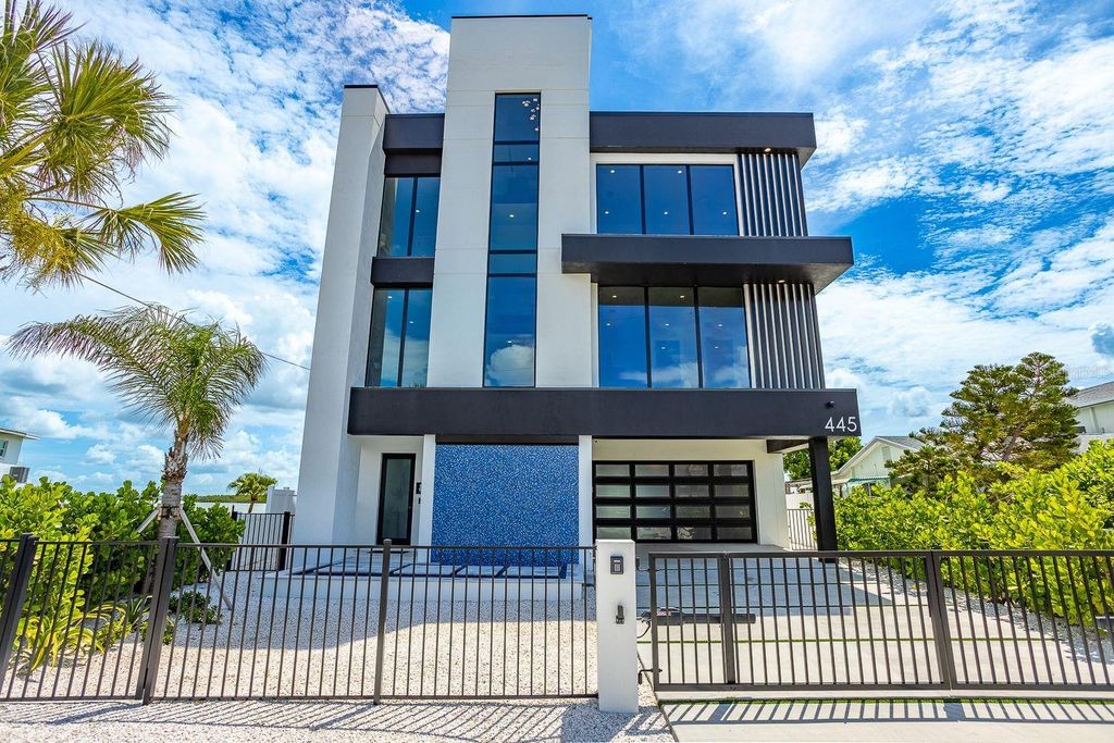 Photo of 445 129th Avenue E, Madeira Beach, FL 33708 (MLS # TB8427384)