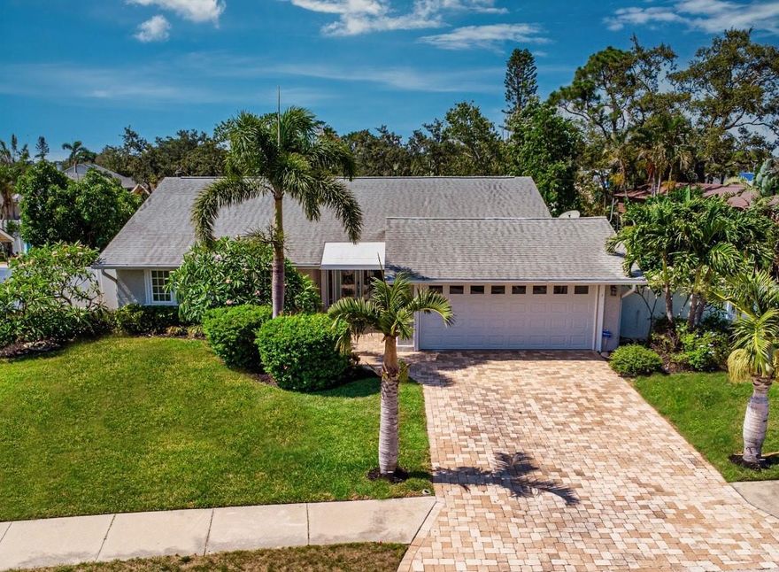 Beautifully remodeled in 2025, this modern coastal retreat offers the perfect blend of comfort, style, and Florida living just 6 miles from the world-famous beaches of Anna Maria Island. Ideally located near Robinson Preserve, Palma Sola Causeway, IMG Academy, shopping, dining, boating access, and area airports, this spacious 4-bedroom, 2-bath home is designed for both relaxing and entertaining. With its prime location near beaches and airports, the property also offers excellent potential as a short-term rental or seasonal investment opportunity.
Inside, you’ll find an open-concept layout filled with natural light, vaulted ceilings, updated finishes, and a thoughtfully redesigned interior. The kitchen features stainless steel appliances, stone countertops, and generous gathering space that flows seamlessly into the living and dining areas. Both bathrooms were beautifully updated during the 2025 renovation, including a spa-inspired primary bath retreat.
Step outside to your own private backyard oasis featuring a heated screened pool with a refurbished pool cage and upgraded no-see-um screens, new pool pump and heater (2025), a custom tiki bar and grilling area, outdoor lounge spaces, and a fun backyard putting green. The spacious fenced yard includes vinyl privacy fencing with gates on both sides, allowing secure storage for a boat or recreational equipment inside the fenced area.  Additional highlights include Flood Zone X designation with no storm damage from recent storms, paver driveway, irrigation system, dual-zoned A/C, whole-home alkaline water system, ample parking, and easy access to the nearest public boat ramp just 1 mile away. Located in a quiet neighborhood yet minutes from beaches, boating, nature preserves, and downtown Bradenton amenities, this move-in-ready home offers an exceptional opportunity to enjoy the best of the Gulf Coast lifestyle!