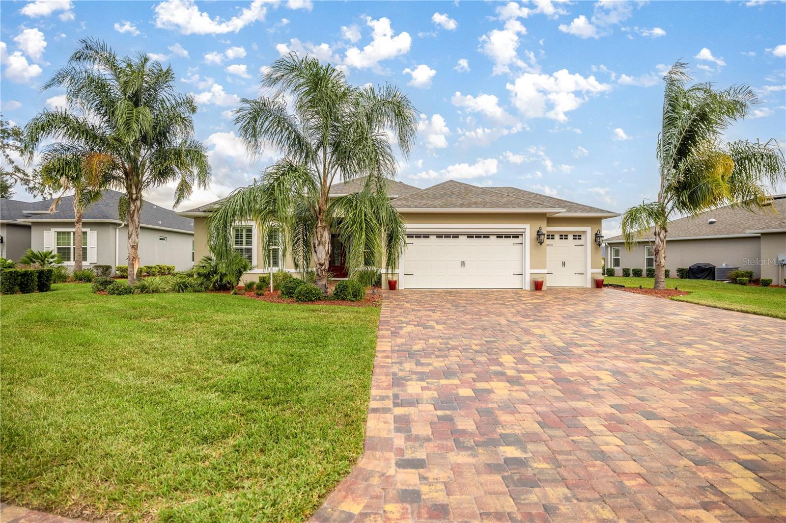 ASSUMABLE MORTGAGE at an incredible 2.375% interest rate! This nearly new, solar-powered Berkshire model is located in the highly sought-after Enclave at Lakeside Landing and offers the perfect blend of luxury, functionality, and sustainability. Featuring 3 bedrooms, 2 baths, and a versatile bonus room, this spacious 2,340 sq. ft. home is situated on a beautifully landscaped 0.32-acre lot with an oversized driveway, a large garage, and a separate golf cart bay. Inside, the open-concept layout is ideal for both everyday living and entertaining, highlighted by a chef’s kitchen with stainless steel appliances, quartz countertops, an expansive island, and abundant cabinetry. The living and dining areas flow seamlessly to the screened lanai, which features brand-new Chattahoochee stone flooring—perfect for enjoying Florida’s outdoor lifestyle year-round. The bonus room, complete with custom built-ins and a built-in desk, provides the perfect space for a home office, library, or creative studio. Thoughtful upgrades include plantation shutters, custom closet systems in every bedroom, enhanced lighting, garage ceiling storage racks, quick screen additions on the garage and front doors, pull-down attic stairs, and a smart garage door opener. Powered by an advanced solar system, this home’s electric bill is limited to the power company’s low $33 monthly administrative fee. Residents of Lakeside Landing enjoy access to an impressive array of resort-style amenities, including a waterfall pool, secondary pool, hot tub, clubhouse with billiards room, tennis and pickleball courts, putting green, dog park, and playground. The HOA covers lawn care and trash pickup, allowing you to enjoy a low-maintenance lifestyle. Meticulously maintained and move-in ready, this home offers timeless style, energy efficiency, and everyday comfort in one of the area’s most desirable communities. Schedule your private showing today!