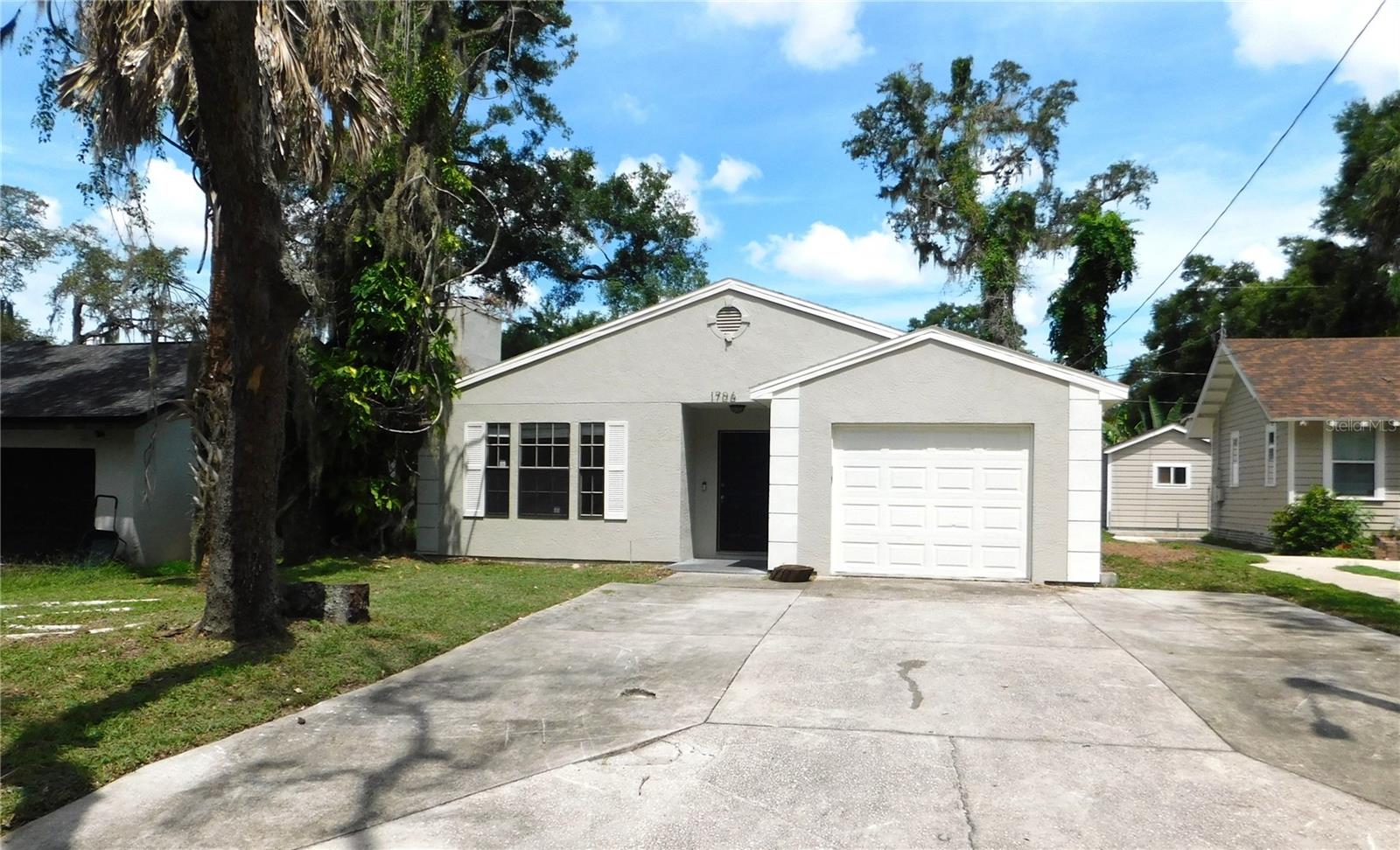 Welcome to this beautifully updated 3-bedroom, 2-bath, 1-car garage home located in the highly sought-after Old Seminole Heights area. Step inside to a spacious living room featuring tile flooring and a cozy fireplace, perfect for relaxing or entertaining. The remodeled kitchen boasts brand-new cabinetry, granite countertops, and stainless steel appliances, while the adjoining dining room offers flexibility to serve as a home office or den. The primary suite is generously sized and includes a walk-in closet and ensuite bath with a shower/tub combo. The second bedroom is equally spacious and offers direct access to the hall bath, which also features a shower/tub combo. Enjoy the versatile enclosed Florida Room overlooking the large backyard — a great space to relax or easily convert into additional living space. Additional highlights include a brand-new AC system and a central location with easy access to all that Tampa Bay has to offer. Don’t miss your chance to own this charming and move-in ready home in one of Tampa’s most desirable neighborhoods!