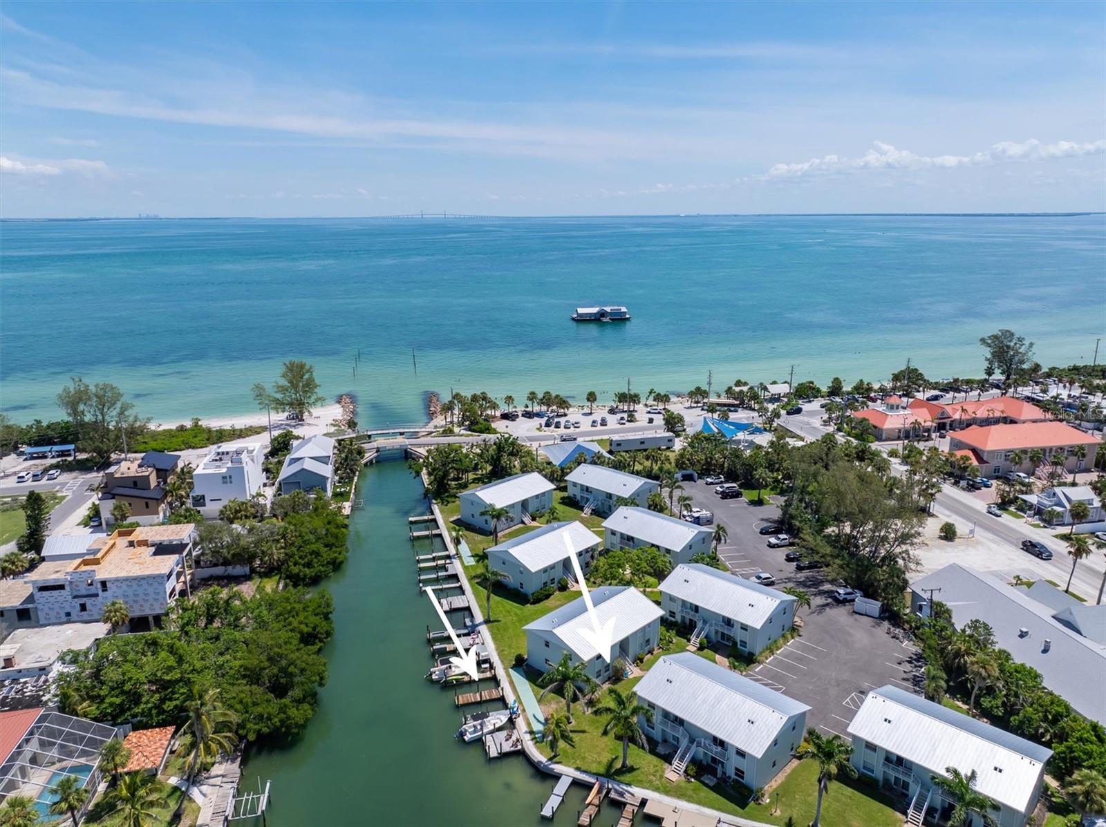 This is your chance to fall in love with this hidden gem - 2 bedroom, 1 bathroom WATERFRONT condo is on the ground floor and is located in the Bayou, Anna Maria City's only condo complex. In the heart of Anna Maria, yet tucked back off of bustling Pine Avenue, enjoy peace and quiet while still being steps away from many shops, restaurants, and white sand beaches. The two beautifully furnished bedrooms are sure to give you a great night sleep! This condo is the perfect getaway for a family with a large king bed in one room and two twins in the other. The kitchen opens up into the living room making it the perfect space for the whole family! Relax at night on the cozy back porch or take a short walk to the beach to watch the sunset! The price includes boat slip number 16 it is right out your back door! 2 week rental minimum for those of you that want an investment property. Schedule your showing today!