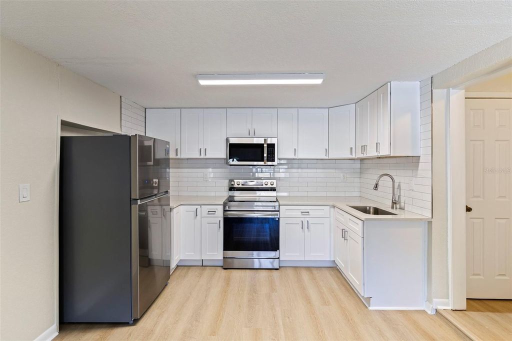 Photo of 1035 Martin Luther King Jr. Ave, Dunedin, FL 34698 (MLS # TB8475663)