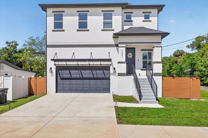 Welcome to this stunning modern residence in South Tampa where elevated design meets functional living. Built with both style and peace of mind, this home features raised construction and a clean contemporary exterior that immediately stands out.

Step inside to a bright open concept living space with luxury vinyl plank flooring and an effortless flow between the living, dining, and kitchen areas. The chef’s kitchen is the centerpiece of the home, featuring a large quartz island with seating, sleek cabinetry, stainless steel appliances, and ample storage, perfect for entertaining or everyday living.

The main living area opens to a spacious covered balcony, creating seamless indoor and outdoor living and an ideal space to relax or host guests year round.

Upstairs, the primary suite creates a private retreat with generous proportions, a walk in closet, and a spa inspired bathroom complete with a freestanding soaking tub, glass enclosed shower, and dual vanities. Additional bedrooms are well sized and thoughtfully positioned, giving flexibility for guests, family, or a home office.

The fully fenced backyard provides privacy and room to enjoy the outdoors, while the elevated design and newer construction add confidence and long term value. The oversized garage offers excellent functionality with high ceilings and built in overhead storage racks, providing plenty of space for organization while still comfortably accommodating parking.

Conveniently located near dining, shopping, and everything South Tampa has to enjoy, this home combines modern design, a smart layout, and an unbeatable location.