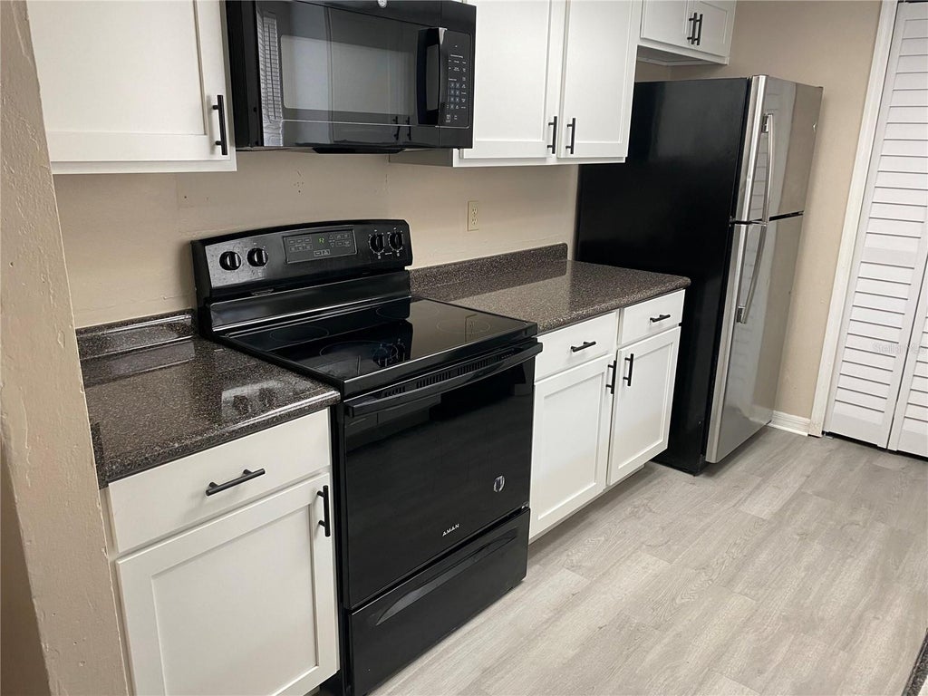 Photo of 6763 Magnolia Pointe Circle, Orlando, FL 32810 (MLS # O6438466)
