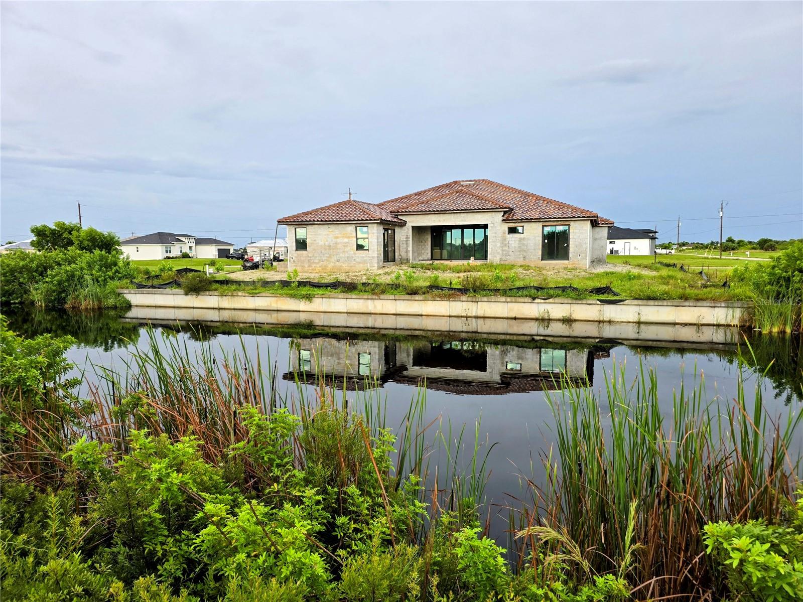Build Your Dream Home in Northwest Cape Coral!
Discover the perfect canvas for your new home on this Eastern Exposure freshwater canal lot in one of the most desirable areas of the Northwest Cape. This growing neighborhood is filled with stunning new construction homes, giving you the best of both worlds—an established community atmosphere with plenty of space and privacy.
The Northwest Cape is quickly gaining recognition as a top destination in Cape Coral, making this property a smart choice not only for building today but also as a long-term investment. Nearby, the newly opened Crystal Lake Park offers endless opportunities to enjoy the outdoors with its walking paths, sandy beach, picnic shelters, playground, fitness stations, kayak and canoe launch, lookout hill, boardwalk, and more—perfect for family fun, exercise, or simply unwinding by the water.
For additional recreation, the Tranquility Lakes RV Resort is just minutes away, spanning nearly 200 acres with two large lakes, approximately 500 full-hookup RV sites, and incredible amenities that add to the lifestyle appeal of the area.
With quick access to shopping, dining, schools, and major roadways, this lot combines convenience with serenity. Whether you’re ready to start building right away or simply want to secure a premium homesite for the future, this property delivers unmatched potential in a thriving community.
Don’t wait—be part of the exciting growth in the NW Cape today!