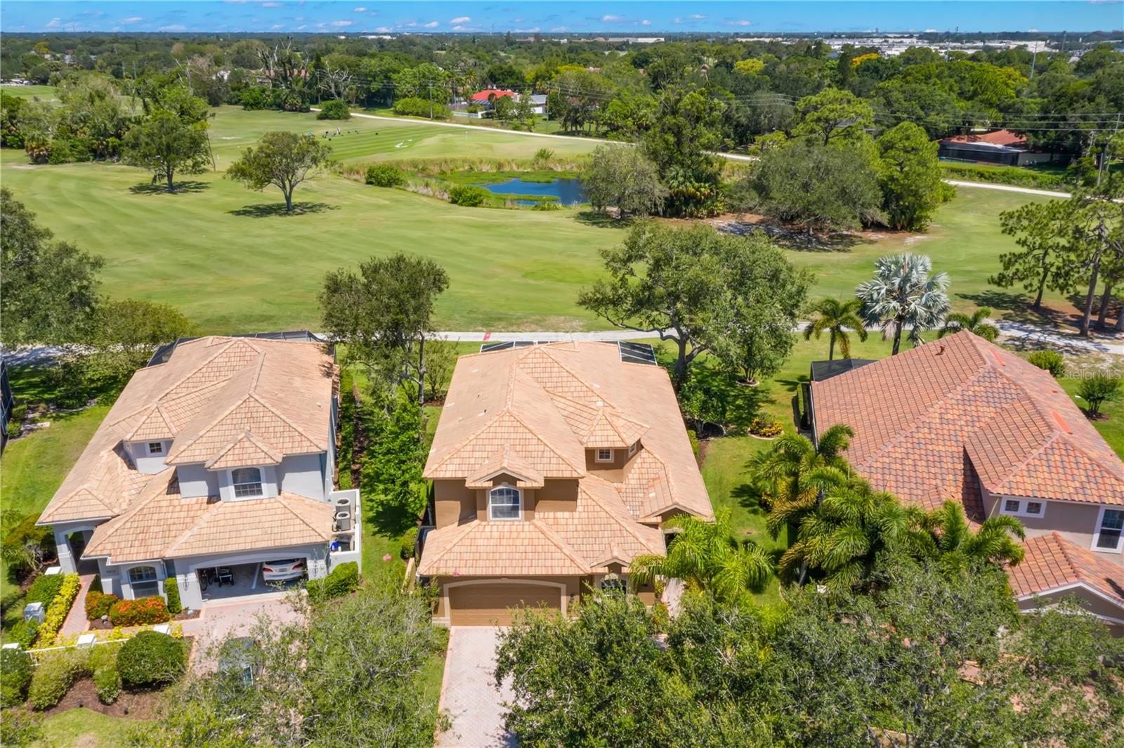 The Bayou Club is a prestigious community with 400 luxurious homes on just over 400 acres of land. The 24 hour guard gated entry will welcome you into the community with mature tree-lined streets and views of Pinellas County’s only Tom Fazio Signature Golf Course! This private pool home has been meticulously maintained and move-in ready. The curb appeal is a SHOWSTOPPER! A mixture of lush & tropical plantings including mature palm trees and colorful shrubbery will welcome you to the covered entry. Inside, the foyer offers privacy from everyday living and is IMPRESSIVE with a rotunda ceiling and space for a drop zone/entry table. There is a formal dining room which is currently being used as a family room and has many other options for use! The GREAT room is GRAND with soaring TWO STORY ceiling heights! The living room has plenty of space for larger furniture, multiple seating areas and the fireplace is flanked by CUSTOM built in shelves and cabinetry that houses your electronic items. The casual dining space is nestled in the bay window that overlooks the pool and golf course while having quick access to the kitchen which has wood cabinetry, newer refrigerator (2020), oversized closet pantry and a breakfast bar which is ideal for those quick meals! Your OASIS awaits through the collapsable sliders where you will enjoy your PRIVATE POOL that overlooks the first hole of the renowned course! Florida living at its finest with multiple seating options that are under cover/roof and will shelter you from the weather when needed while having plenty of pool deck space for lounging in the sun. The pool cage has been given an UPDATE with paint, all new screens, all new reinforced bolts and new base bolts. You can secure the pool while not in use with the newer (2020) child safety gate. The master bedroom is on the FIRST FLOOR and has an expanded living space with a bay window. Two closets, including one walk-in, provide plenty of storage space. The en-suite bathroom is spa-like with dual vanities/makeup area, a walk-in shower, garden tub and a separate water closet. The second bedroom is on the first floor and has two closets and a bump out in the window area which is perfect for a reading nook or furniture item! The stairs have wood steps and risers, wood railing/balusters and will land you on the second floor that overlooks the entire GREAT ROOM and POOL! Just stunning! The hallway has wood flooring and all three rooms have been updated with new carpet (June 2023) which is soft on your feet! Both bedrooms are generous in size and storage and bedroom 4 has a built-in window bench with an arched window. The office is accessed through the French doors and has a CUSTOM built in wood desk. The second full bathroom has a tub/shower combination, dual sinks and extra storage in the vanity. The half bathroom on the first floor has been given a makeover with a new toilet, vanity, hardware and faucet. The laundry room is large with a vanity sink and cabinet storage. Updates and features include leaded glass entry door, newer laminate flooring (2020), 5” baseboards, plantation shutters, recessed lighting and a wall of storage in the garage. Amenities include a community pool. 24/7 fitness, walking distance to the putting green. Landscaping maintenance, irrigation, garbage and recycling are included in your low HOA fee. Located 30 minutes to Tampa International Airport, 20 minutes to the #1 Rated St. Pete Beach and vibrant downtown St. Pete!