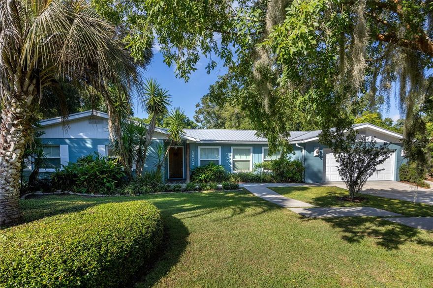 Under contract-accepting backup offers. One or more photo(s) has been virtually staged. W E L C O M E | h o m e to Gainesville Country Club and to this lovingly lived in and updated 1529 square foot block home, featuring lush, mature landscaping, metal roof (~2017), brand new water heater (2025), newer windows, and sitting on .45 acres. Cross through manicured landscape by way of mod concrete paver pads through the solid wood front door into the open concept living space, showcasing two flexible living spaces, great for dining or living in either. Host dinner party platters or appetizers on the beautiful granite countertops in a kitchen boasting all stainless steel appliances, and enjoy peace of mind for clean up with a brand new dish washer (2025), metal farm basin sink, and flattop stove. Move to the bedroom wing where you’ll find updated bathrooms, LVP flooring, and shiplap ceilings. Enjoy relaxing or entertaining in the amply sized screen patio (~37' x15') and fully fenced private backyard oasis; equipped with market lights, fire pit, Myer Lemon and Grapefruit trees and mature lush landscaping. You’ll also find a sizable 2-car garage, air-conditioned laundry/storage room, as well as an additional parking pad located just outside the garage access door; great for parking a boat, airstream, golf cart, or toy of choice. Located ~4.6 miles from Shands, ~ 5.7 miles to HCA North Florida, ~2.6 miles to SouthWest side of UF, .3 miles to I75 and ~.5 miles to local grocery and restaurants, placing many local landmarks within a 10 minute drive. Check out what could be your private slice of Gainesville Country Club today! Buyer to confirm all facts.