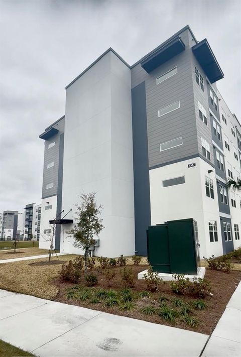 Photo of 5587 Millenia Park #201, Orlando, FL 32839 (MLS # S5143984)