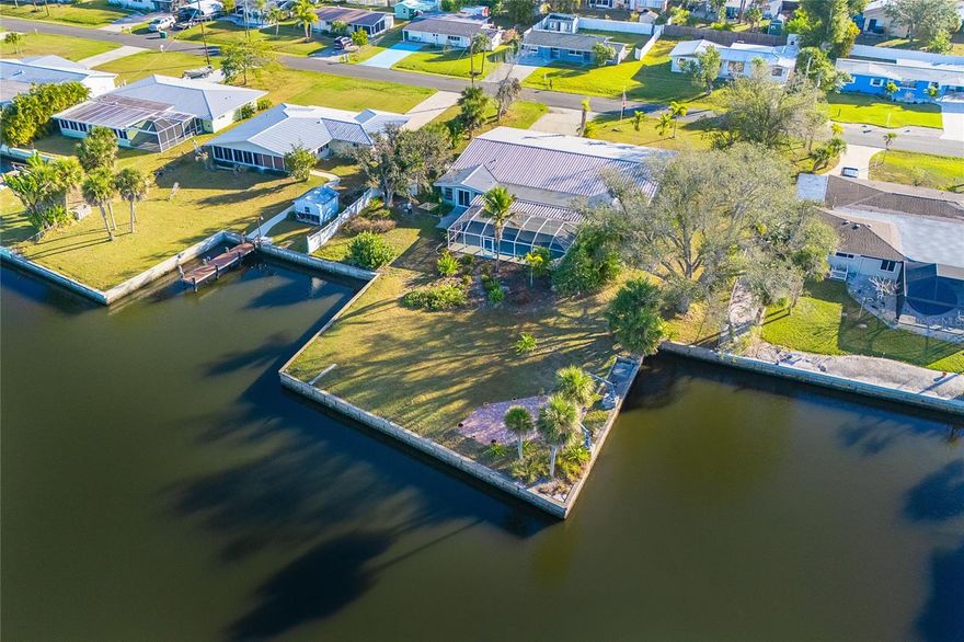 MOTIVATED SELLER - Fully remediated flood-damaged Gottfried Creek waterfront home offered AS IS. Featuring a Metal Roof, and brand new gunite in-ground freshwater pool 30' x 13' Kidney Shaped which was installed Post Fall 2024 Hurricanes. The main residence offers the room dimensions for four (4) bedrooms and two (2) full baths. A spacious Great Room, Florida Room, Patio, Screened in pool area and oversized two (2) car garage. A separate entrance, self contained Mother-In-Law suite is livable and contains a bedroom, bathroom, Kitchenette, and private laundry - ideal for extended family, guests or owner occupancy while the renovations are completed. Enjoy 215' of seawall frontage on Gottfried Creek. The brick paver waterside outdoor deck provides the perfect setting to watch Manatees and Dolphins glide by or take in the breathtaking evening sunsets over the water.