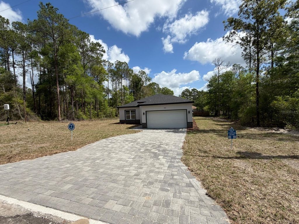 Photo of 9905 N Odessa Way, Dunnellon, FL 34434 (MLS # O6396228)