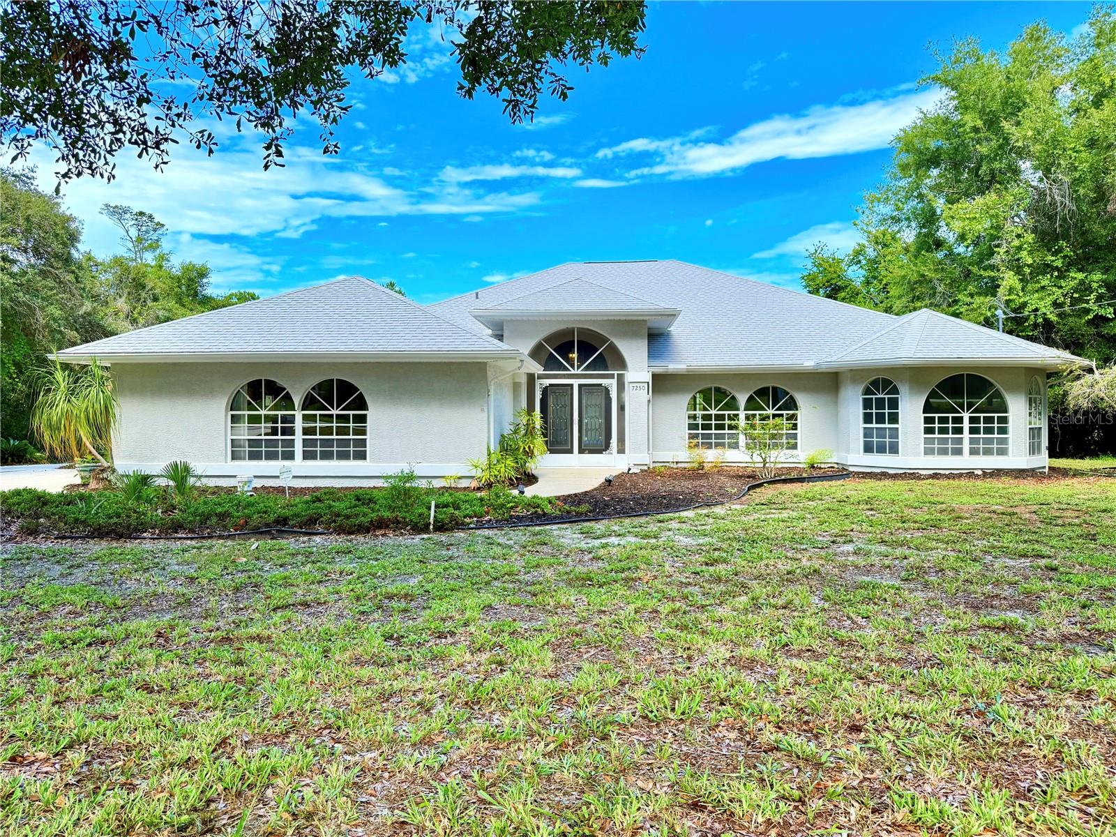 Under contract-accepting backup offers. Welcome to 7250 River Country Drive, a spacious pool home nestled on a full acre in the desirable River Country Estates community of Weeki Wachee. This 3-bedroom, 2.5-bathroom residence offers the perfect balance of privacy, comfort, and potential—ideally situated just minutes from the Weeki Wachee River and local amenities. Inside, the well-designed split floor plan features tall ceilings, generously sized bedrooms, and multiple living and dining areas, creating a comfortable and versatile layout for everyday living and entertaining. The oversized two-car garage provides ample space for storage or hobby use. Step outside to enjoy the Florida lifestyle with a large covered patio, outdoor kitchen, and a refreshing pool—ideal for year-round enjoyment. The private backyard setting enhances the tranquil, country-like feel while still being conveniently located near shops, restaurants, and major roads. Priced with built-in equity for savvy buyers or investors. An exceptional opportunity to own a well-maintained home with room to add value in one of Weeki Wachee’s most established communities. Schedule a tour today! 2018 Roof, 2019 A/C, No flood zone.
