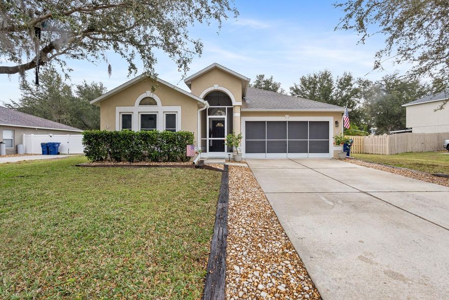 Attractive 4 bedroom, 2 bathroom home in Groveland with a fenced-in back yard has a lot to be excited about. This home has fresh interior paint, new baseboards and trim as well as brand new luxury vinyl planks, tile and carpeting throughout. The open living/dining rooms make this a great place to welcome friends and family. The kitchen has new granite countertops, new tile backsplash, new stainless-steel appliances and a coffee bar and is adjacent to a separate family room leading to a screened back lanai. The master suite boasts a beautiful and totally renovated, huge master bath with a barn door entry featuring a brand new double sink vanity and stylish large shower. The gorgeous tile really sets this room apart. The second bathroom has also been completely updated as well. All lighting, fans and windows have been updated throughout the home. This home is fresh and ready for your personal touches to make it your own! Convenient to shopping, restaurants, schools and much more. Roof was replaced in 2018, A/C replaced in 2021 and the water heater was replaced in 2020.