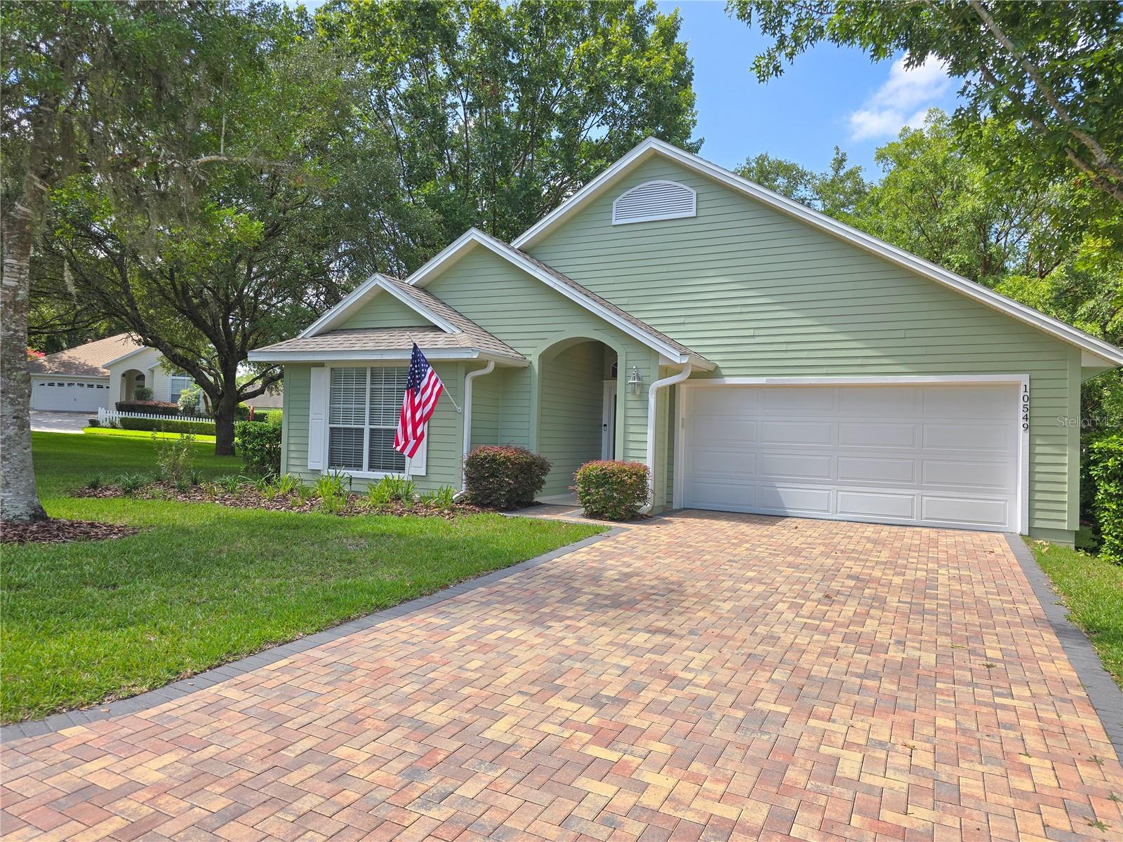 One or more photo(s) has been virtually staged. Welcome to carefree living in one of Gainesville’s few gated communities. This beautifully updated Jeffrey Wilde-built home sits on one of the largest green spaces in the neighborhood—no side neighbor, just a 4-minute walk to the resort-style amenities. THIS HOA COVERS SO MUCH- Be sure to read in full. * Fully repainted inside and out in July 2025, this home is truly move-in ready. Enjoy fresh landscaping, updated flooring, refinished wood cabinetry in the kitchen & bathrooms, stylish new lighting, and a completely remodeled primary shower with new tile. Additional upgrades include a 2022 roof, new water heater, smart washer and dryer, and a fully replaced garage door and motor, and appliances. The open layout features soaring ceilings, wood floors, plantation shutters, and a light-filled kitchen with quartz countertops, ample storage, and a skylight. The split floor plan includes a spacious primary suite and two guest bedrooms—one with a built-in desk ideal for an office or creative space. Relax in the enclosed, climate-controlled Florida room (two-zoned AC), or step out to the wraparound deck, perfect for entertaining. With the HOA covering lawn care, siding, roof, and more, you can enjoy the lifestyle you’ve been looking for—without the maintenance. Minutes from University of Florida, Santa Fe College, I75, Ocala and so much more! Call your VIP TOUR today!