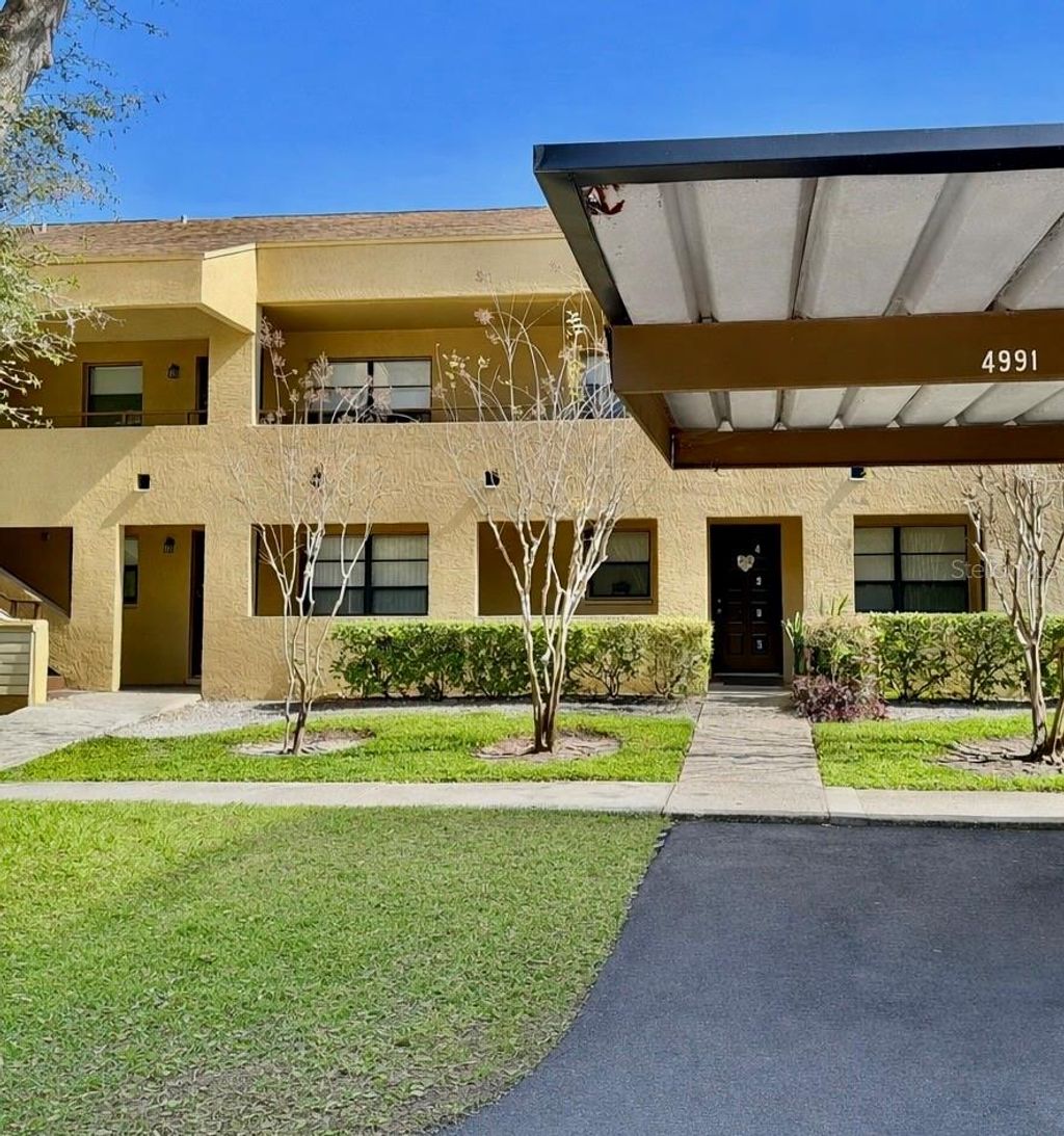 Photo of 4991 Puritan Circle #522, Tampa, FL 33617 (MLS # TB8467240)