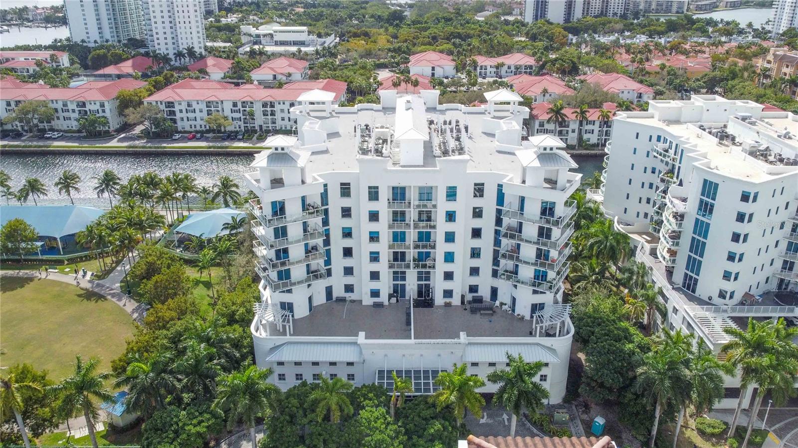 ALL ASSESSMENTS PAID—NO UPCOMING SPECIAL ASSESSMENTS FROM THE HOA BOARD.
Poised in the heart of Aventura with tranquil canal views, this refined 2-bedroom plus den, 2-bath residence offers a seamless blend of elegance, comfort, and modern convenience. Encompassing 1,453 square feet of meticulously curated interiors, the home presents a turn-key opportunity for the discerning buyer seeking both sophistication and serenity.
Upon entry, marble tile flooring sets a tone of understated luxury, guiding you through a light-filled open living and dining space where expansive windows invite the beauty of the outdoors in. The kitchen, thoughtfully designed for culinary pursuits, features sleek stainless steel appliances, a brand-new refrigerator, and a spacious pantry, all harmonizing form and function.
The primary suite serves as a private retreat, complete with dual walk-in closets and a beautifully reimagined en suite bath showcasing double vanities, an oversized walk-in shower, and a sculptural standalone tub. The second bath, equally refined, offers a modern walk-in shower with crisp, clean finishes. A versatile den provides flexibility for a home office, reading room, or guest quarters, adapting effortlessly to suit your lifestyle.
Two private balconies overlook the peaceful canal, offering a daily invitation to slow down—whether savoring a morning espresso or unwinding with an evening glass of wine. Enhancements throughout the home include fresh paint on every surface, a new water heater, and remote-controlled room-darkening blinds in key living spaces, elevating both aesthetics and comfort. A dedicated in-unit laundry with washer and dryer ensures day-to-day ease.
Within this exclusive, pet-friendly community, residents enjoy access to a resort-style pool, hot tub, fully appointed fitness center, and conference room. An assigned parking space, two private storage sheds, and EV charging stations further enhance the appeal, while the HOA covers cable, Wi-Fi, water, and sewer—ensuring a lifestyle of effortless luxury.
Located moments from Peace Park, Aventura Charter School, Founders Park, and the iconic Aventura Mall, the residence also offers seamless mobility via the complimentary Freebee ride service, making city exploration both convenient and car-free.
This is more than a home—it’s an opportunity to reside in a thoughtfully upgraded, impeccably located sanctuary. Shown by private appointment only, this Aventura gem is ready to welcome its next chapter.