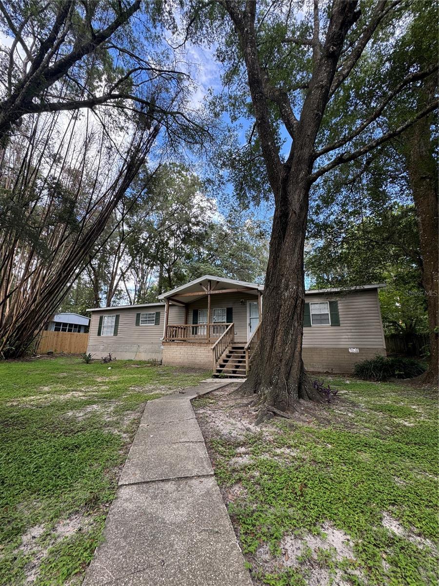 Move-in ready 3 bedroom, 2 bath home with shaded 1/3 acre lot is waiting for a new owner. The kitchen and baths have NEW cabinets, fixtures and newer appliances. Easy care Luxury Vinyl Plank flooring and new carpet in the bedrooms. Enjoy the screened porch and privacy of a fenced backyard. Home is located just south of Ocala and close enough to city conveniences and rural enough for quieter living.