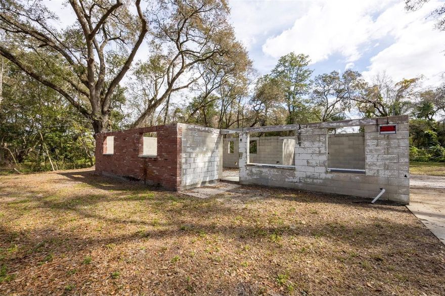 This vacant land has a house that is stripped down to the Block. This property has an AS-1 zoning with a frontage of 100 ft and a depth of 153 ft.you can build your own choice in a convenient location.
All interior finishes have been removed,
 basically leaving the structural shell of the house
“Block” typically refers to the concrete block walls (CMU construction). Someone can remove the existence block wall or get a permit to do the rest and complete the project. The septic tank and well are on the property. The existing block has already been under 1199 sq ft of Gross or Heated area. It is easy to make a duplex house.