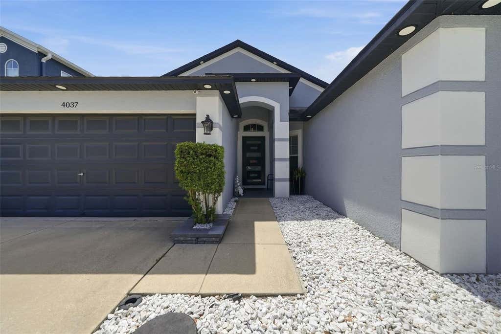 Photo of 4037 Warwick Hills Drive, Wesley Chapel, FL 33543 (MLS # TB8538829)
