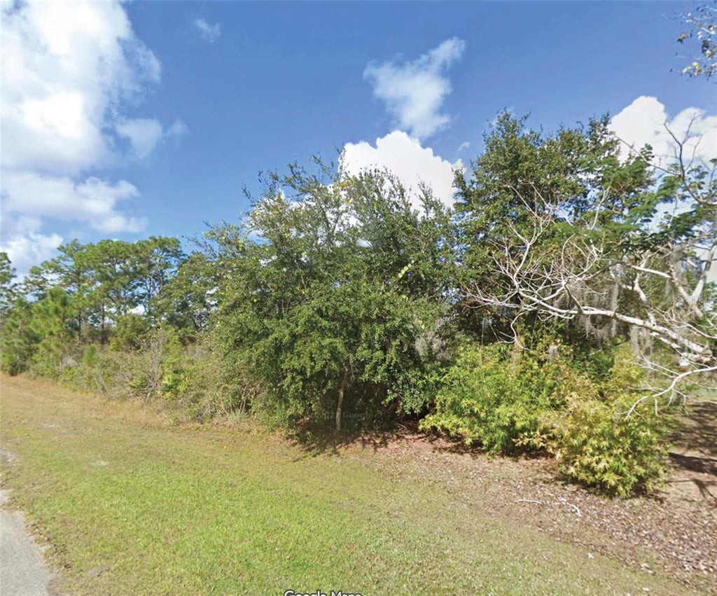 Photo of 10 Camellia Drive, Indian Lake Estates, FL 33855 (MLS # O6438264)