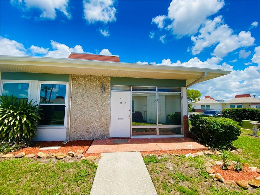 Beautiful corner unit.  This unit is a 2 bedroom 1 bathroom, the primary room offers a walk in closet. Located in the highly desirable gated 55+ community of Tahitian Gardens. This rarely available corner unit offers enhanced privacy, peaceful views, and direct access to the community's scenic walking path ideal for enjoying Florida's tranquil lifestyle. Enjoy your morning coffee or evening breeze from your private front patio area. Whether you're downsizing, looking for a seasonal residence, or seeking a low-maintenance lifestyle, this move-in ready villa is an excellent choice. Tahitian Gardens offers an abundance of resort-style amenities including a heated swimming pool, shuffleboard, clubhouse, and an active calendar of social events. Conveniently located near shopping, dining, public transportation, and just minutes from the Gulf beaches, the Sponge Docks, and everything Tarpon Springs has to offer.
