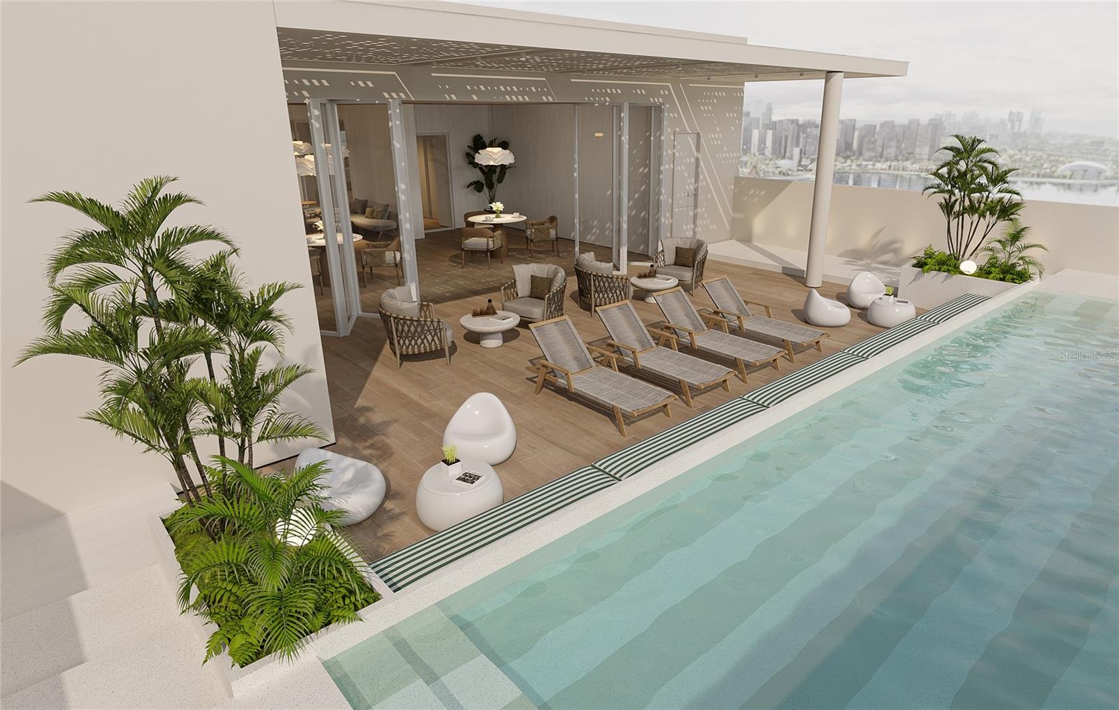 One or more photo(s) has been virtually staged. Pre-Construction. To be built. The Nautilus experience begins with a luminous entrance, where manicured landscaping highlights a carefully preserved original banyan tree. The Nautilus is an exclusive collection of 13 condominium residences, where innovative design, craftsmanship, and artistic expression blend seamlessly with natural beauty. Designed for those who love to entertain, the living room seamlessly extends to the expansive terrace, forging a connection between the refined interiors and the surrounding cityscape. An abundance of natural light floods the room through floor-to-ceiling Miami-Dade hurricane proof windows, accentuating the exquisite finishes chosen for their elegance and durability. The windowed kitchen and butler’s pantry feature custom-designed cabinetry, adding warmth and refinement while providing ample functional storage. Outfitted with premium Miele appliances and a Sub-Zero refrigerator, the kitchen effortlessly transitions into the dining room via an extra-wide floating island bar—ideal for entertaining guests in a luxurious yet practical setting. With generous proportions and a flexible layout, the study seamlessly balances style and functionality. The expansive primary room easily accommodates a king-sized bed, an oversized custom walk-in closet, and a lavish bathroom. The spacious walk-in closet, complete with bespoke shelving and integrated lighting, ensures your wardrobe is impeccably organized. Double doors lead into the opulent bathroom, featuring bespoke finishes, top-of-the-line Kohler fixtures, and a smart Kohler toilet, delivering a spa-like, high-tech experience within the privacy of your home. The thoughtfully designed second and third bedrooms welcome abundant southern light through floor-to-ceiling windows, each with en-suite bathrooms. The spa-inspired bathrooms are adorned with a curated selection of marble and tile, custom wooden cabinetry, and ambient lighting.Blending Condado’s vibrant energy with tranquil lagoon views, an exquisitely designed tropical resort crowns the Nautilus. The sun terrace features shaded outdoor loungers, manicured greenery, and a classic striped-tile wading pool—inviting residents to relax in the perfect fusion of urban and natural beauty.
The jewel-box rooftop lounge offers an intimate, zen-inspired setting, complete with a full kitchen, bar, and island, softly illuminated beneath a sculpted ceiling. This distinctive space is ideal for peaceful remote work during the day or hosting unforgettable gatherings with friends and family. The serene, state-of-the-art wellness center integrates both strength and cardio equipment, while the tranquil terrace off the gym provides soothing sea views. Morning yoga in the crisp ocean air can be perfectly complemented by a relaxed coffee or tea.The sunlit, travertine-clad lobby features a mailroom and a discreet package room with cold storage for groceries. An elegant custom concierge desk, adorned with carefully curated artwork and a bespoke sculpted-glass chandelier, creates a refined yet welcoming ambiance.Two parking levels include a porte-cochere for effortless drop-offs with direct lobby access. Each residence comes with two parking spaces, an electric vehicle charging port, and a generously sized storage unit. Additional parking spaces are also available for purchase.
Breaking Ground 2025
Estimated Year Completion: End of Year 2027/Early 2028