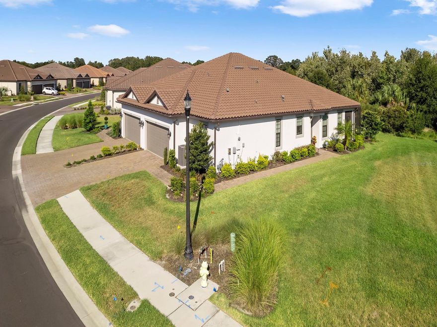 Welcome to the Esplanade of Artisan Lakes, where luxury living meets resort-style amenities in north Manatee County! This paired Villa is a true gem and an absolute must-see. Formerly a community model home, this like-new property is filled with a long list of builder upgrades making it a stunning home. Step inside this 2-bed, 2.5-bath home and be greeted by an open floor plan that provides a sense of space and light. The gourmet kitchen boasts top-of-the-line appliances and custom features that will make cooking and entertaining a joy. Throughout the home, you'll find accents galore, showcasing the attention to detail that went into its design including high-impact windows and doors. Venture outside to the extended lanai, where you can enjoy the Florida lifestyle at its finest. The oversized lot with a wooded backdrop offers privacy and tranquility, creating a serene outdoor space that you'll love spending time in. Esplanade of Artisan Lakes offers a first-class amenity center, complete with a resort-style pool that will make you feel like you're on vacation every day. Stay active and fit with access to a top-notch fitness center, pickleball, and tennis courts. This community truly has it all, providing you with the lifestyle you've always dreamed of. Don't miss out on this amazing opportunity. Schedule a viewing today and experience the epitome of indoor and outdoor living with all the amenities you could ever want.