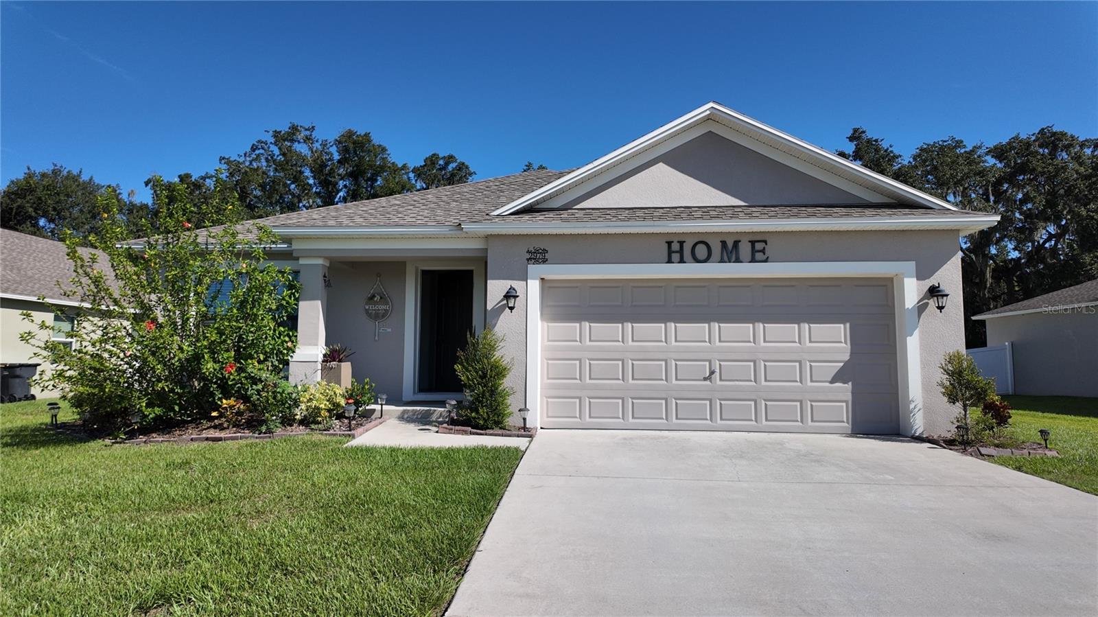Are you looking for A BEAUTIFUL NEW BUILT RENTAL HOUSE? Welcome to this stunning 4-bedroom, 2-bath home located in the PRIVATE and SAFE GATED Creeks Crossing community. Offering 1,965 square feet of living space, this home features an OPEN FLOOR PLAN with low-maintenance LAMINATE FLOORING, a SPACIOUS KITCHEN with 42-inch cabinets, quartz countertops, ISLAND BAR, and stainless steel appliances. The primary suite boasts a large bathroom with dual sinks, upgraded tile, a garden tub, and separate shower. Additional highlights include inside laundry and a fully fenced backyard. Conveniently located just FEW MINUTES to I-4, the Polk Parkway, shopping, and dining—this home is move-in ready and waiting for you!