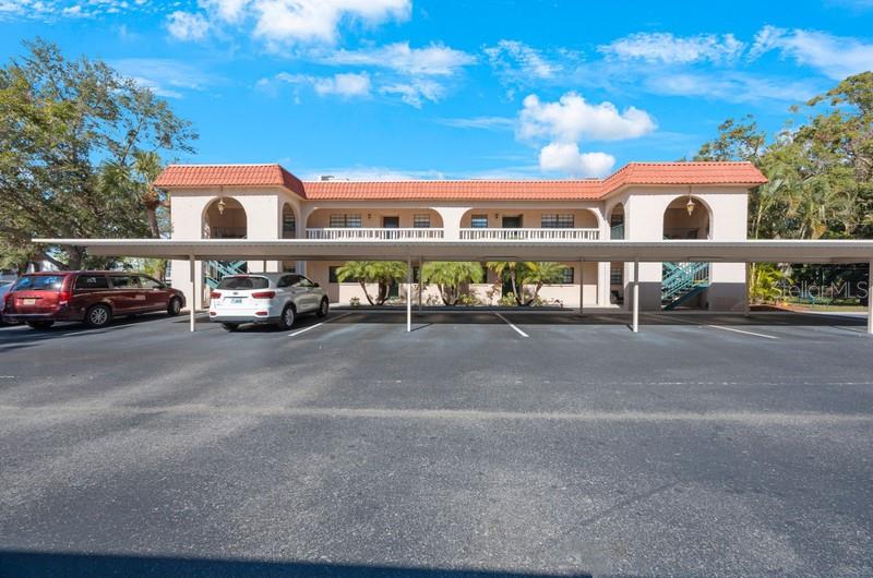 Fantastic opportunity to lease, lease-to-own, or own a corner unit on the ground floor, with a pond view in the desirable community of Belleair Forest. Fantastic location, just minutes to the beaches and entrance to the Pinellas trail is right next door. This two bedroom two bath condo comes with covered parking right outside your front door, as well as guest parking. Master bedroom is spacious and has a nice walk-in closet with an on-suite bathroom. The unit has an inside washer and dryer for your convenience. The view from your private back porch overlooks a beautiful pond. A perfect spot for entertaining friends or relaxing. There is also a community pool with an outdoor bar-b-que grill. With the option to lease or lease to own, this is a must see, and will not last long. Call today for a preview!