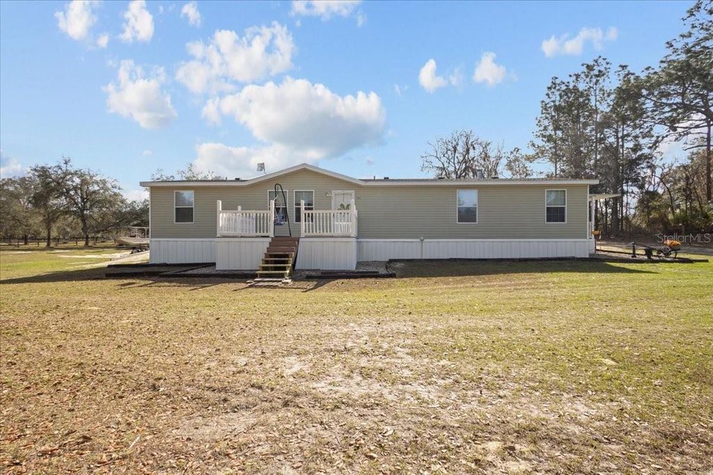 Photo of 11990 SE 55th Lane, Morriston, FL 32668 (MLS # W7882165)