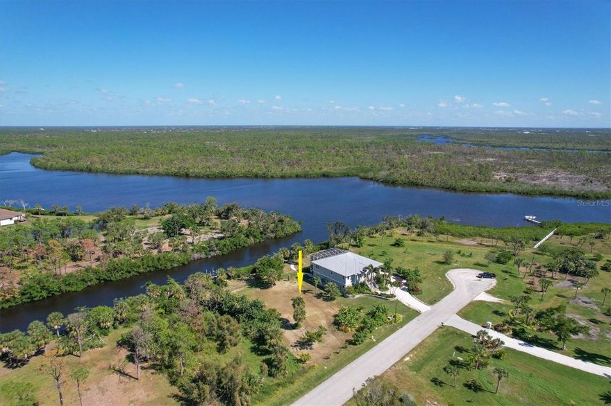Come see this beautiful WATERFRONT lot in the PRIVATE GATED community of Coral Cove. This exceptional property has 100 feet of shallow water draft frontage along the pristine Amberjack Waterway, a quiet and protected waterway off Coral Creek. This lot is one of the few with mature trees and unspoiled views. The property has a brand new rebuilt boat dock including 4 new pilings and a 10,000-pound boat lift already installed. Take your kayak, standup paddleboard or flats boat out from your very own existing boat dock into the magical waters of Coral Creek and the ICW within minutes. You can watch the manatees swim by, and fish off your boat dock! This exceptionally oversized waterfront lot has direct access to Gasparilla Sound, Charlotte Harbor, Boca Grande Pass, Lemon Bay, and best of all the Gulf of Mexico. This private community is in the quiet fishing village of Placida, known for its sandy beaches, and exceptional fishing, including the world’s largest Tarpon tournament, and a laid-back kind of living attitude. You have several golf courses less than 5 minutes away, as well as a few shopping centers for your shopping needs. Coral Cove provides a terrific, secluded lifestyle and a neighborhood filled with upscale homes. The community has a HOA which includes oversized roadways, park-like common landscaping, underground utilities and public water and sewer. This oversized home site is ready for you to build your custom dream home on. If you think it might be time to make this dream a reality, call today to make an appointment!