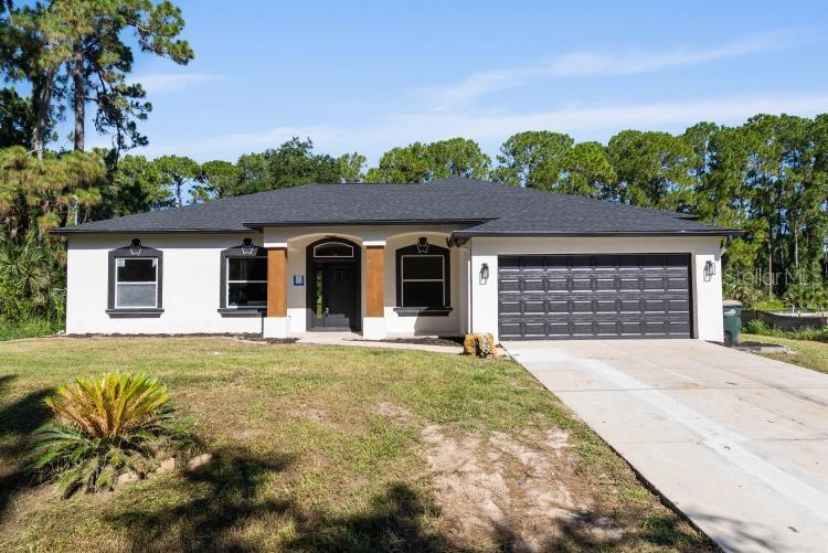 One or more photo(s) has been virtually staged. This home is nestled on a peaceful circle of newer homes in North Port just minutes from shopping, dining, and I-75. It offers a comfortable living space with a bright open floorplan. This would also make for a great investment property. Inside you will find a functional layout with a spacious living area that flows into the kitchen, beautiful cabinets, ample counter space, and a nice island. Many updates have been made to this home, but there is still room to add your own personal touches. Outside the large backyard offers plenty of space for outdoor activities or a pool. This home is a great opportunity for anyone looking for a well-situated property with tons of potential. Schedule a showing today and come see for yourself.