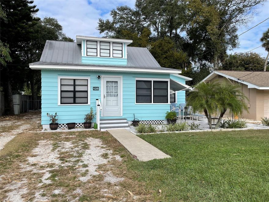 Charming cottage home that gives you the Key West feel every time you pull in your driveway. Offers 2 bedrooms and 1.5 baths. Plus a reading/work out room that has a water view. The front patio was just done in April of 2021, perfect for enjoying the water view in the evening. This home would make a great starter or vacation home. Only .10 of a mile walk from the intracoastal. Fully fenced yard with a spot to park a boat or jet ski. Exterior pain was done in August of 2021. ;Water: City