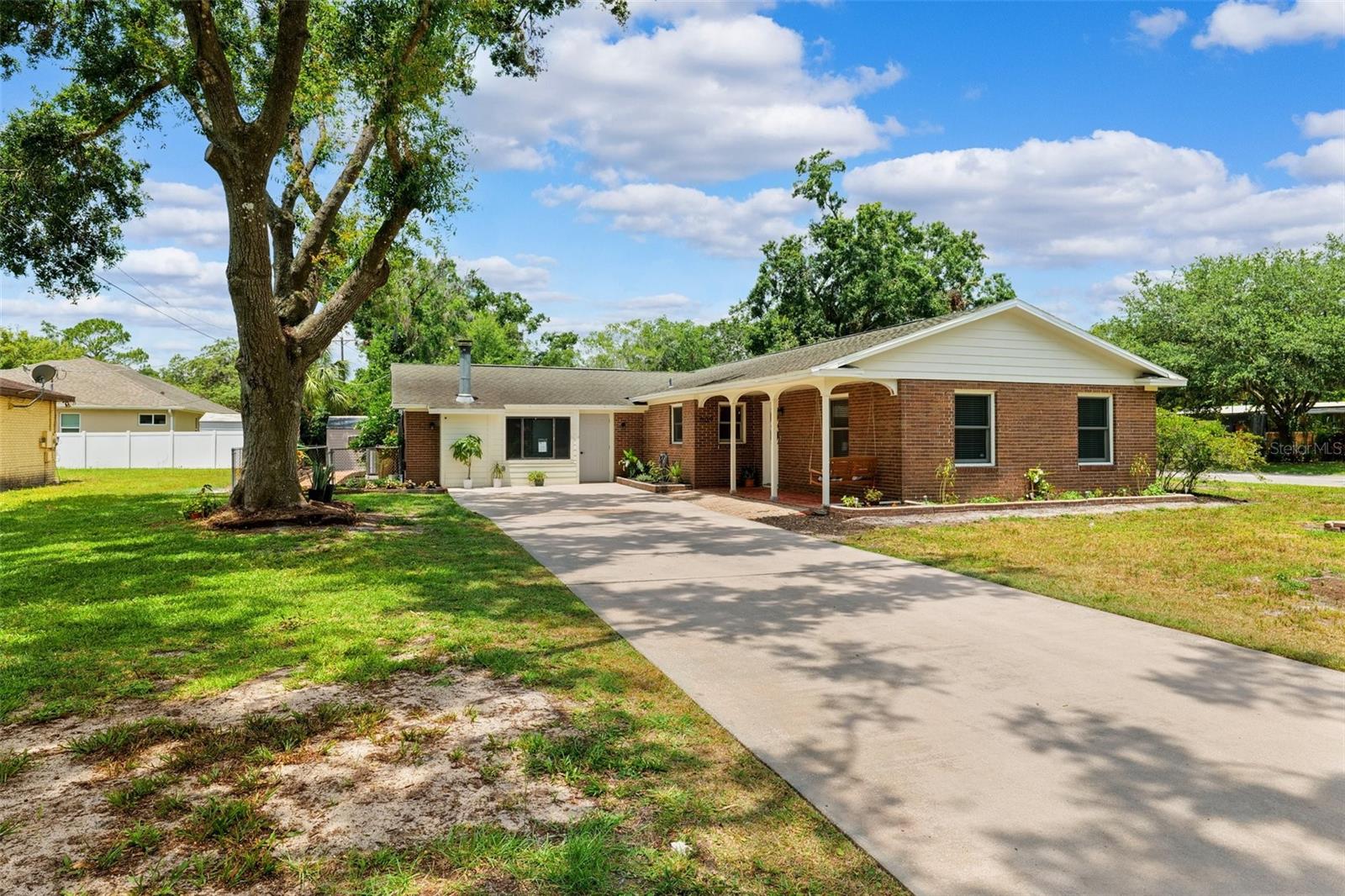 One or more photo(s) has been virtually staged. Beautifully Updated Home on a Spacious Corner Lot – Blending Modern Upgrades with Everyday Comfort!
This thoughtfully Renovated Home is packed with upgrades and offers a functional layout on a large, fenced corner lot.
Interior Features: Remodeled Kitchen (2022) with Shaker-Style soft-close Cabinets, Dolomite Countertops, Farmhouse Sink with attachments, GE stainless steel appliances, and sleek finishes. Luxury Vinyl Flooring throughout main living areas, primary bedroom, and second bathroom. Second bathroom recently updated with freestanding soaking tub, rain shower head, and handheld sprayer—plus smart speakers and fans. Electrical upgrades, including new receptacles and switches. Remodeled areas taken down to the studs, featuring all-NEW Insulation and Drywall. Fresh Interior Paint, updated lighting, and new window screens. Systems & Major Updates: *Two HVAC systems replaced (2020 & 2023) with smart thermostat controls *Tankless Water Heater for main living areas and secondary bedrooms *Separate water heater for the primary suite *NEW Roof June 2025, to include a transferable warranty. Exterior & Location: *Large fenced corner lot with refreshed landscaping—perfect for entertaining, relaxing, or outdoor activities. Minutes from Hillsborough Park (tennis, playground, public boat ramp). Centrally located near USF, Moffitt Cancer Center, VA Hospital, University Community Hospital, and easy access to I-4, I-275, and I-75. Move-in ready, tastefully upgraded, and ideally located—this home is a must-see!