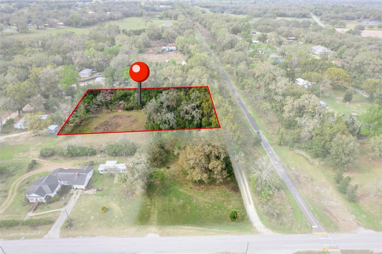 1.1-acre unimproved parcel located in Trilby. No HOA. No CDD. Build the custom home of your choice with room for a pool, garden, workshop, or RV/boat storage. Enjoy country living with privacy and space while being minutes from historic downtown Dade City with shops and restaurants, close to the Withlacoochee Trail for outdoor recreation, and convenient to I-75 for commuting to Wesley Chapel, Tampa, Tampa International Airport, St. Pete and world renowned beaches. Don't miss this once in a lifetime opportunity to build your forever home.