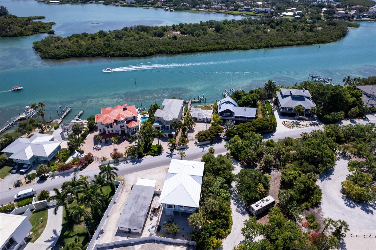 This Home truly paints a picture of coastal paradise! From the private pathway leading to the pristine sands of Nokomis Beach providing access to endless adventures on the Gulf of Mexico, every detail seems designed to immerse residents in luxury and tranquility.
The three-level retreat embodies a masterpiece of design and comfort, with each floor offering its own unique charm. The screened-in balcony, where one can savor the coastal breeze while gazing at the mesmerizing waves, is the perfect spot for relaxation. And the fully enclosed yard, shaded by swaying palm trees, creates an idyllic setting for outdoor gatherings and leisurely moments.
Ascending to the third floor via elevator is like stepping into a world of unparalleled beauty, with the kitchen, living room, and primary bedroom strategically positioned to maximize the breathtaking views. The kitchen, adorned with stylish solid surface countertops and top-of-the-line appliances, is like a culinary haven where gourmet meals are effortlessly prepared. And the living room, with its panoramic vistas, promises moments of pure indulgence and relaxation.
After a full day of beachcombing or boating adventures, retreating to the luxurious embrace of the primary suite and all of its comforts. With a king bed, a walk-in closet and opulent bathroom featuring dual vanities and a large jetted soaking tub, it's a sanctuary of comfort and luxury. There is a second bedroom with a queen and a full bed and a third bedroom with 2 twin beds. In the family room, there are two queen size pull-out sofas.
Overall, this residence epitomizes coastal living at its finest. Impeccably maintained and freshly painted throughout, it's ready to welcome each guest to embrace the allure of Casey Key and make unforgettable memories in this breathtaking oasis of luxury.
Casey Key truly offers a beachside setting that's unmatched in its peaceful ambiance and natural beauty, making it an ideal destination for a vacation home retreat. With its pristine beaches and picturesque scenery, it's easy to see why travelers are drawn to this romantic city.
While staying in Casey Key, you'll have the opportunity to explore not only the local beaches but also the charming restaurants that add to the area's allure.