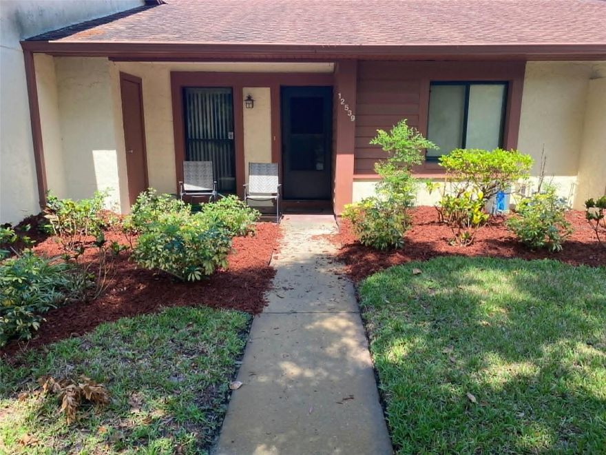 Welcome to Paradise in this lovely 2 bedroom, 2 bath condominium in an active 55 plus community of Glenwood Condominiums. Excellent location of this unit provides no immediate rear neighbors and a relaxing view from the Florida room and Primary bedroom of Bear creek with its variety of bird life. Condo features great room and split bedrooms with primary bedroom having a walk-in closet and full shower bathroom. Unit has a relaxing front porch to enjoy coffee and morning breezes. Carport gives you protective covered parking. The active clubhouse has pool, tennis, fitness room and more. Come enjoy the best of affordable Florida condo living near shopping, hospital, parks and beaches.