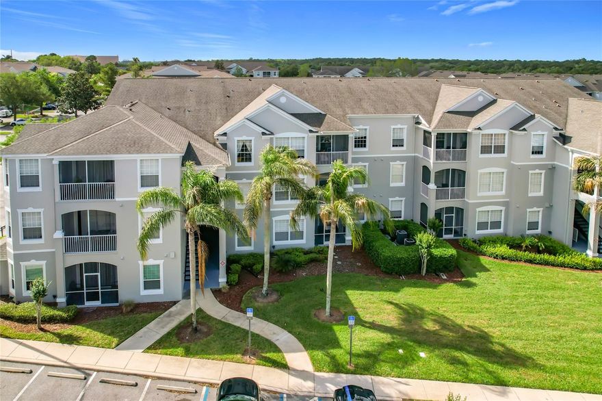 FIRST FLOOR condo  in Windsor Palms Resort, just a few miles from Disney Parks and local attractions.  SHORT TERM RENTALS ALLOWED.   This property is in great condition with NEW windows (2024), NEW HVAC (2025),  NEW Stainless steel appliances (2026), Ceramic Tile in living areas and Laminate flooring in all bedrooms.  FURNISHED and ready for rental with everything you need for a vacation home or rental property. The property has three bedrooms, two bathrooms , over twelve hundred square feet of living space and a screened outdoor porch. Located in the highly sought after Windsor Palms, one of the top vacation rental communities in the area, less than five miles from Disney Parks.  Restaurants, supermarkets, shopping and golf are a short drive away.  The community features a clubhouse with tiki bar that serves food, resort pool and splashpad, games room with billiards tables, movie theater, convenience store, basketball, tennis  and volleyball courts, all within a guard gated entry. This unit is a must see.