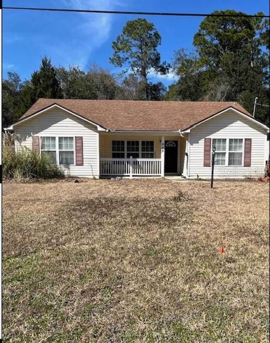 Well-maintained 2005 Ranch - style home with no HOA and a brand new septic tank installed in January 2026. Major systems include AC and roof replacements in 2016, and a water heater replacement between 2012 and 2013.
This 3-bedroom 2-bathroom home features tile flooring in the kitchen, dining area, and both bathrooms, with carpet in the bedrooms and living room. Vaulted ceilings enhance the open feel, and ceiling fans are installed in each bedroom and the living room. The property features privacy fencing on both sides, a partially wooded backyard, and two storage sheds.