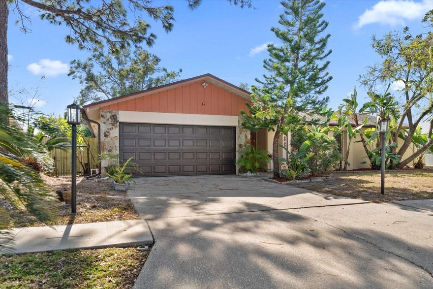 One or more photo(s) has been virtually staged. An incredible find within a jewel box of a cherished community- Welcome Home to your impeccable, solid all block home within the tangible 

And site relevant Lake Park Estates, tucked away for its’ privacy, yet central to all The Seminole Corridor offers. Iconic mauve double doors greet You as you enter a wraparound open concept floor plan with integrated living and dining w/vaulted ceilings and abundant recessed lighting with the kitchen, breakfast and family room w/fireplace just around the bend..An ideal split bedroom lay-out allows for a spacious Primary suite w/en-suite, two more bedrooms which share a bath(that also can be utilized as your pool bath), and a full laundry/utility room. Now for our upgrades: The Kitchen, Primary Bath, and most of the flooring was wholly remodeled less than 3 years ago while the 2nd bath remodel and both bedrooms enjoy new flooring less than a month old. The accompanying refinements include: Crisp white cabinetry, stone counters, pristine white w/modern tile encased bath walls and floors. An elongated covered lanai stretches the width of the living area and looks over the SOON TO BE REFURBISHED POOL W/ BIRDCAGE WHICH HAS BEEN CONTRACTED TO BE FINISHED AT THE TIME OF THIS LISTING. This spectacular family home enjoys the following structural improvements: New A/C(2022), New Water Heater(2024), Roof(2013). I look forward to your impressions..