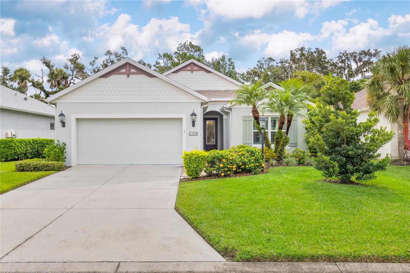 One or more photo(s) has been virtually staged. Tucked within the gated community of Forest Creek, this 3 bedroom, 2 bathroom plus a den home is perfectly situated on a peaceful preserve, offering serene views and a private backdrop for everyday living. As you step inside, you’ll notice the thoughtful layout featuring updated luxury vinyl plank flooring, crown molding, plantation shutters, and an abundance of natural light . From there, the home flows seamlessly into the living room where you’ll notice the formal dining room, and spacious kitchen that is designed for both style and functionality with granite countertops, a tasteful tile backsplash, plenty of cabinetry, plus a bright breakfast nook that looks out toward the preserve. The primary suite serves as a quiet retreat, while two additional bedrooms share a guest bathroom with a beautifully updated walk-in shower. Your very own private oasis awaits as you step outside to the extended lanai, complete with a hurricane-rated roll-down screen and tranquil views—perfect for coffee in the morning or entertaining in the evening. Recent updates include a newer roof (November 2024) and A/C system (2023), both with transferrable warranties. This lovely Florida Costal inspired home combines modern upgrades with peace of mind. With low HOA fees and plenty of amenities such as a pool, clubhouse, walking trails, and scenic lakes, all in a location convenient to shopping, dining, and I-75. Please note the total amount of the property tax bill includes the CDD.