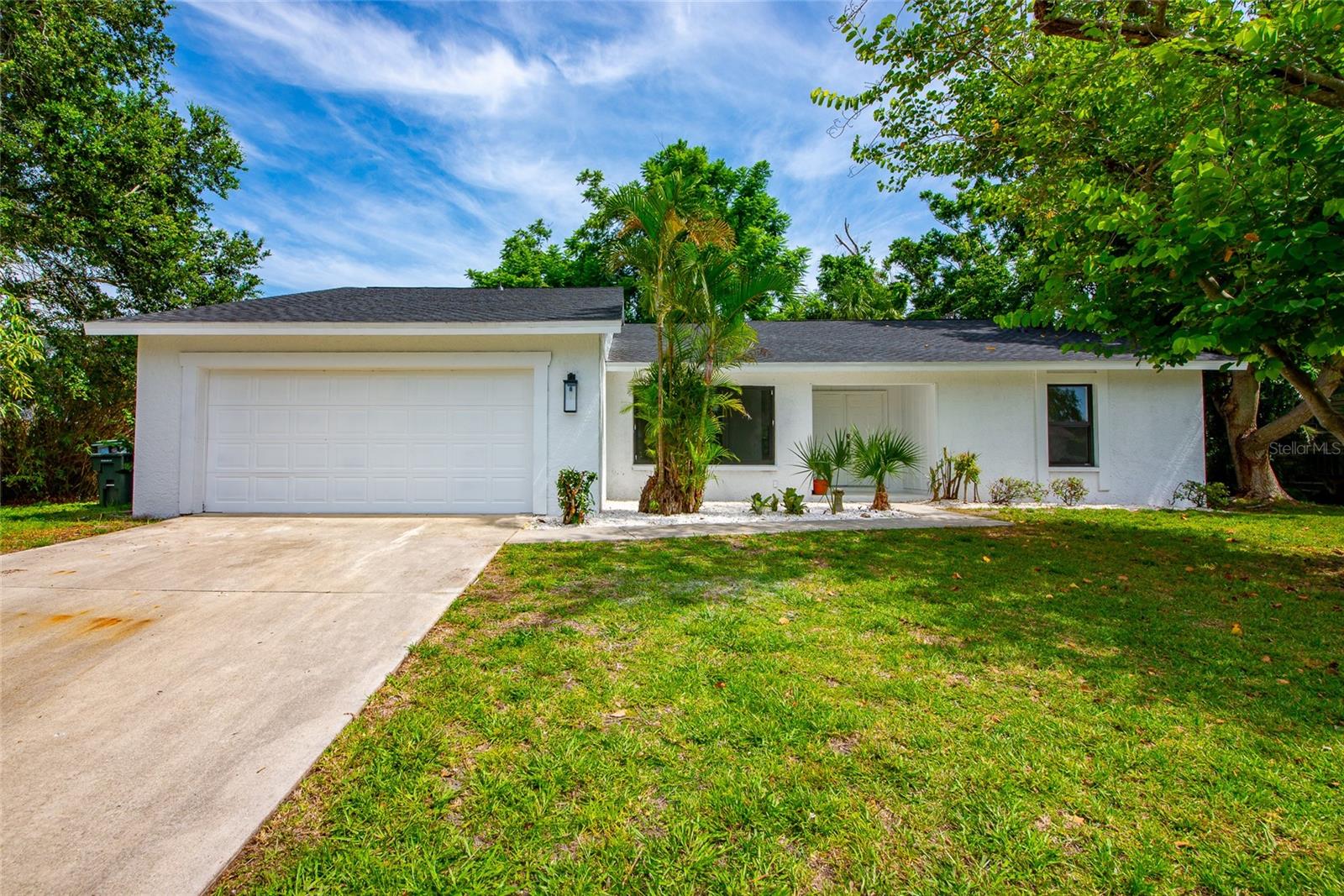 Welcome to your new home, a true gem and Sarasota’s best-kept secret, located just a five-minute golf cart ride to the world-renowned Siesta Key Beach. This beautifully reimagined home has been completely transformed with high-end upgrades, making it feel like new construction from top to bottom, from door knobs to lights to windows. Step inside to discover a stunning interior where almost everything is brand new. A brand new roof was installed just this past week, along with hurricane-rated impact windows—offering peace of mind and modern efficiency. The home features all-new flooring throughout, creating a cohesive and contemporary look. The kitchen is a showstopper, boasting gorgeous quartz countertops, brand new cabinetry, and one of the largest islands you’ve ever seen—perfect for entertaining and everyday living. Every detail has been thoughtfully updated: all-new interior and exterior doors, every door handle, and modern lighting fixtures throughout the home. This property also features four spacious bedrooms, with the fourth room offering flexibility as a playroom, home office, or guest room—and a closet installation is currently underway to complete the space. Enjoy an open, airy floor plan with abundant natural light, beautifully blending comfort and luxury, all in a quiet neighborhood with close access to shopping, dining, top-rated schools, and, of course, the powdery sands of Siesta Key. This is not just a home—it’s practically brand new and move-in ready. Don’t miss your opportunity to own in one of Sarasota’s most desirable and convenient locations. Schedule your private showing today.