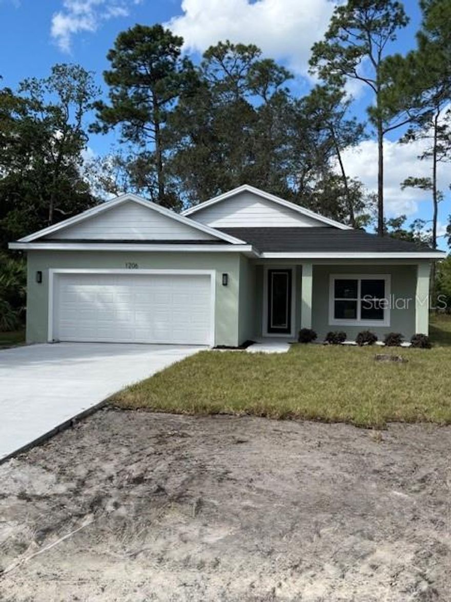 Under Construction. NEW CONSTRUCTION HOME! NO HOA! NOT IN FLOOD ZONE! ON NEWLY PAVED ROAD! Don't miss this great opportunity to own a brand-new 3-bedroom, 2-bathroom, 2-car garage home located just minutes from beautiful downtown DeLand. This home features an open-concept kitchen with a large island, quartz countertops, and stainless steel appliances including a range, refrigerator, dishwasher, and above-range microwave. The kitchen is highlighted by stunning 42'' upper cabinets, while the main living areas offer stylish vinyl plank flooring and both bathrooms are finished with tile. The spacious master suite includes an oversized walk-in closet and a luxurious bathroom with a soaking tub, a beautifully tiled walk-in shower, and double vanities. Throughout the home, you'll find thoughtful upgrades: ceiling fans in all bedrooms and the living room, 5 1/4'' baseboards, insulated double-pane vinyl-frame windows, inside laundry room and architectural shingles. Also includes covered front and back porches!