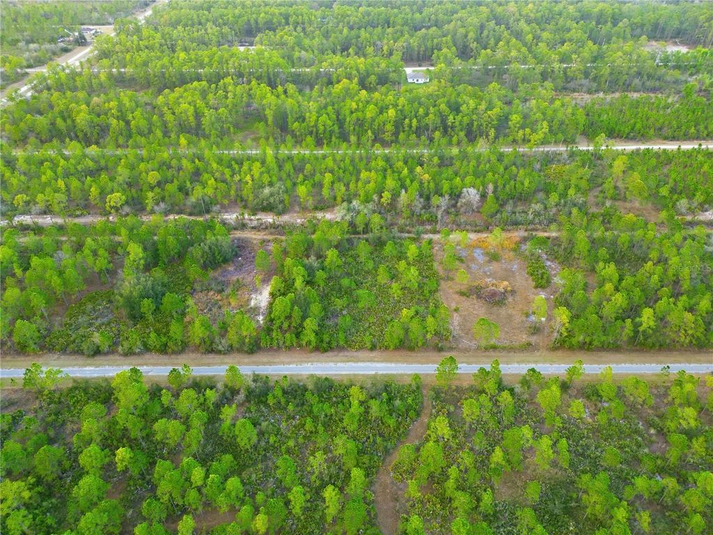 Photo of 310 Tropicana Drive, Indian Lake Estates, FL 33855 (MLS # O6388314)