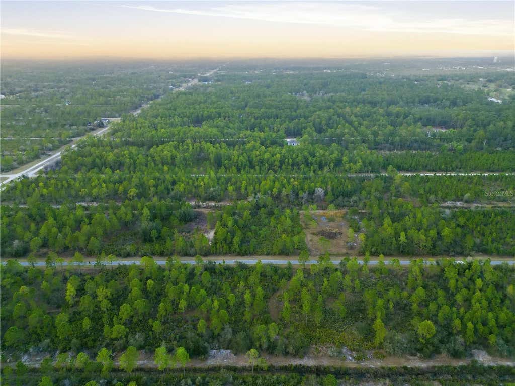 Photo of 310 Tropicana Drive, Indian Lake Estates, FL 33855 (MLS # O6388314)